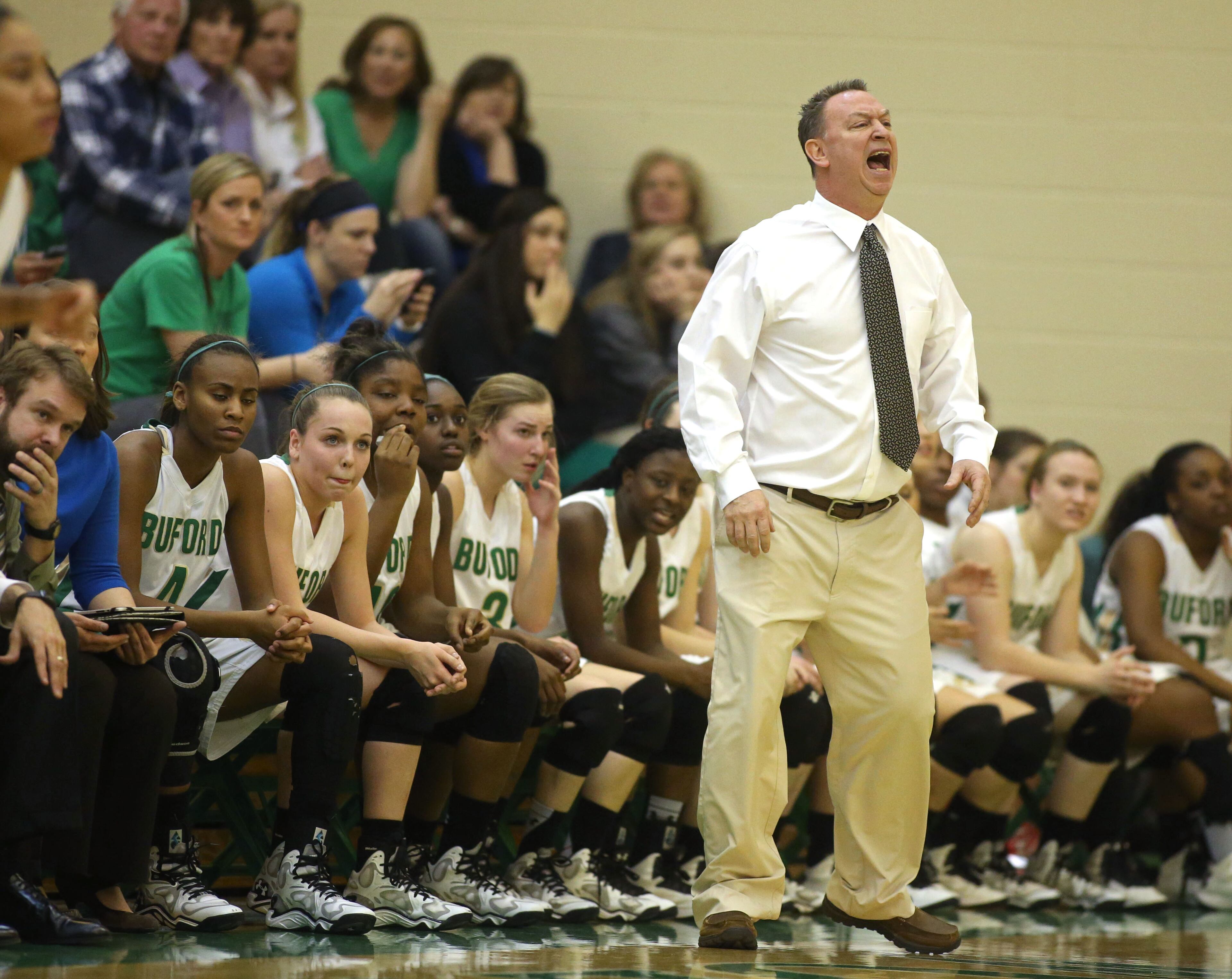 Buford coach Gene Durden directs his players duringsecond round of the Class AAA state basketball tournament Monday night in Buford, Ga. JASON GETZ / SPECIAL