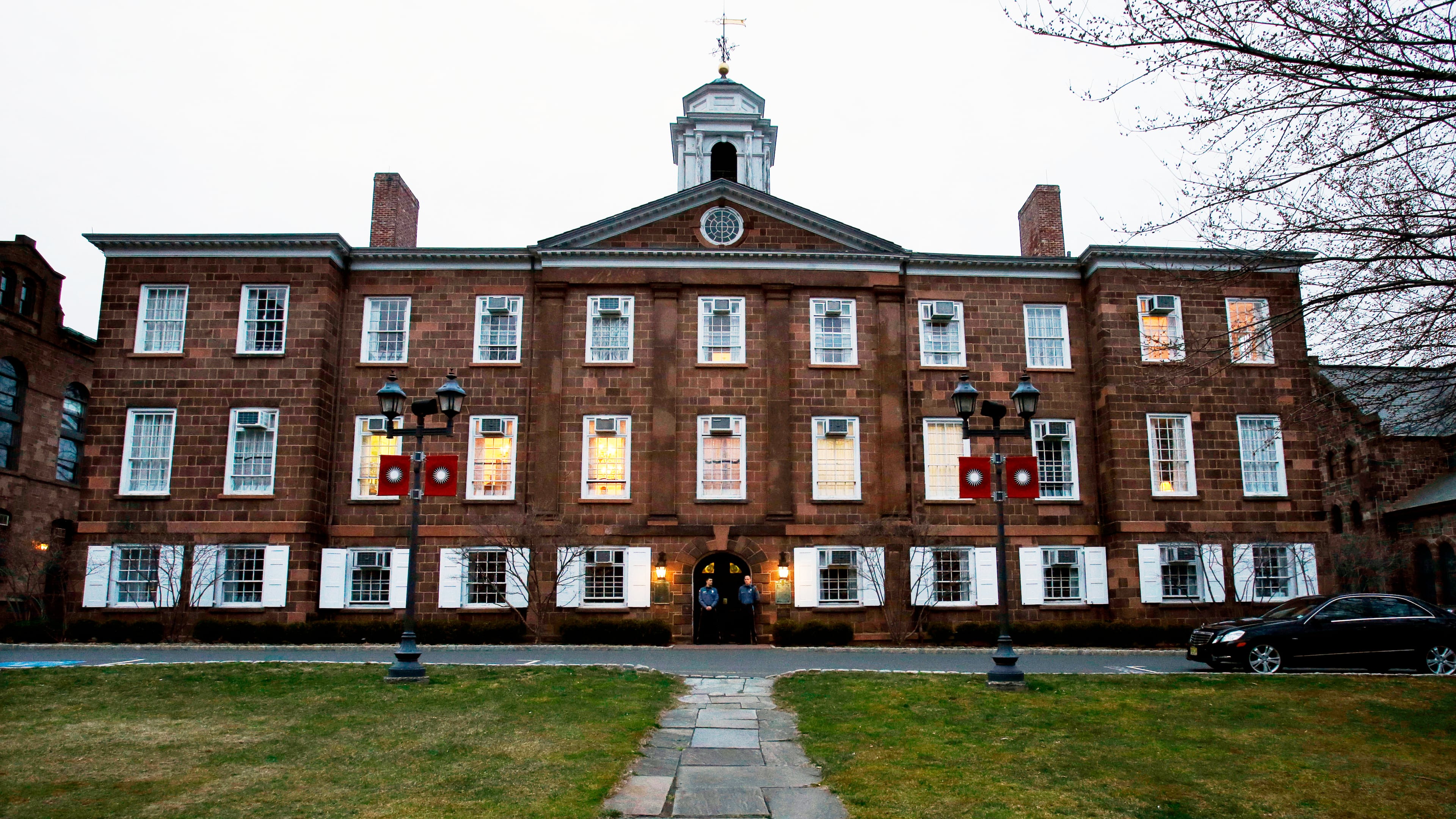 FILE - Lights glow in Rutgers University's Old Queens building, April 4, 2013, in New Brunswick, N.J. (AP Photo/Mel Evans, File)