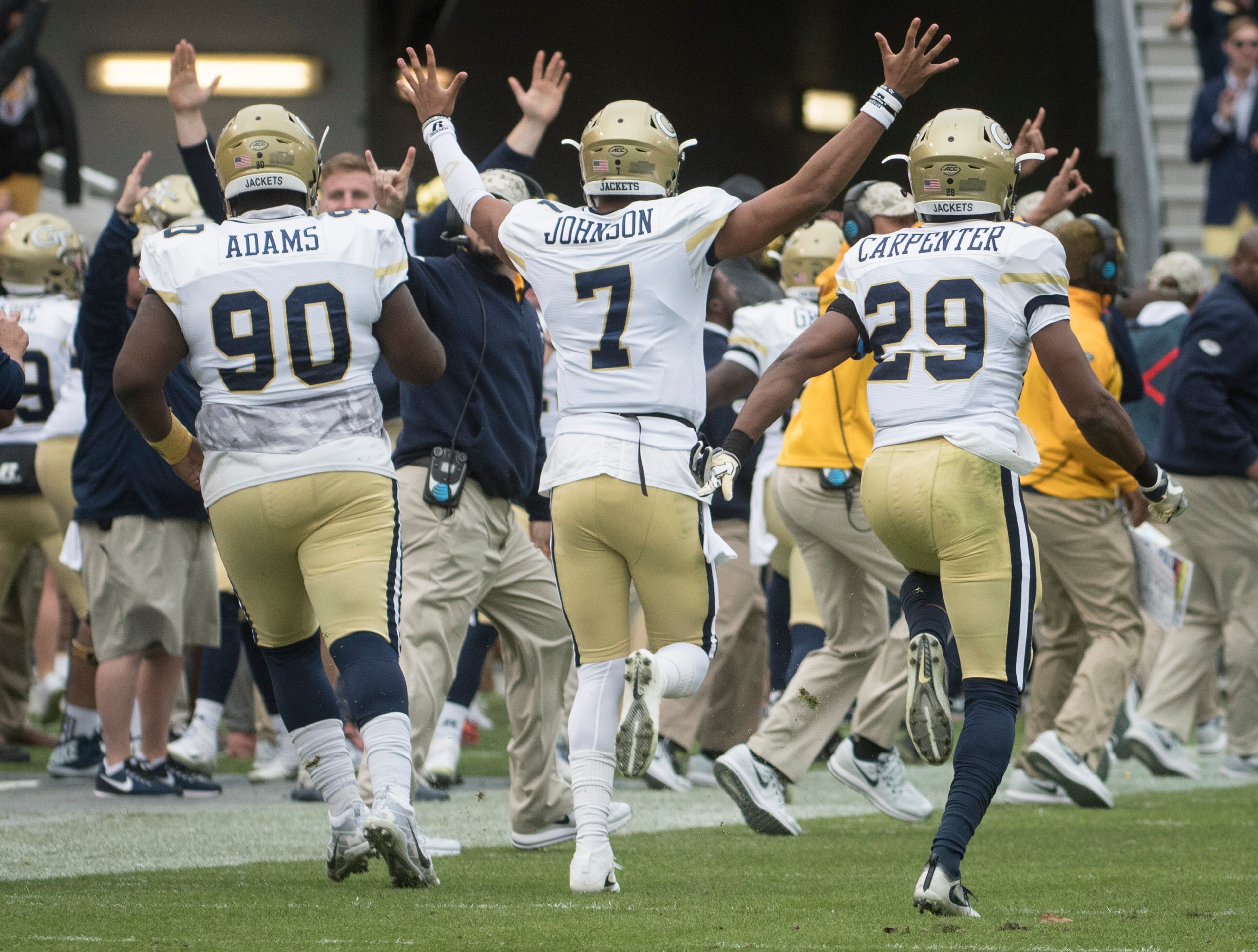Georgia Tech quarterback Lucas Johnson (7) defensive back Tariq Carpenter (29) and defensive lineman Brandon Adams (90) celebrate a touchdown by Ricky Jeune during the fourth quarter of a football game on Saturday, Nov.11, 2017, in Atlanta. (Photo/John Amis)