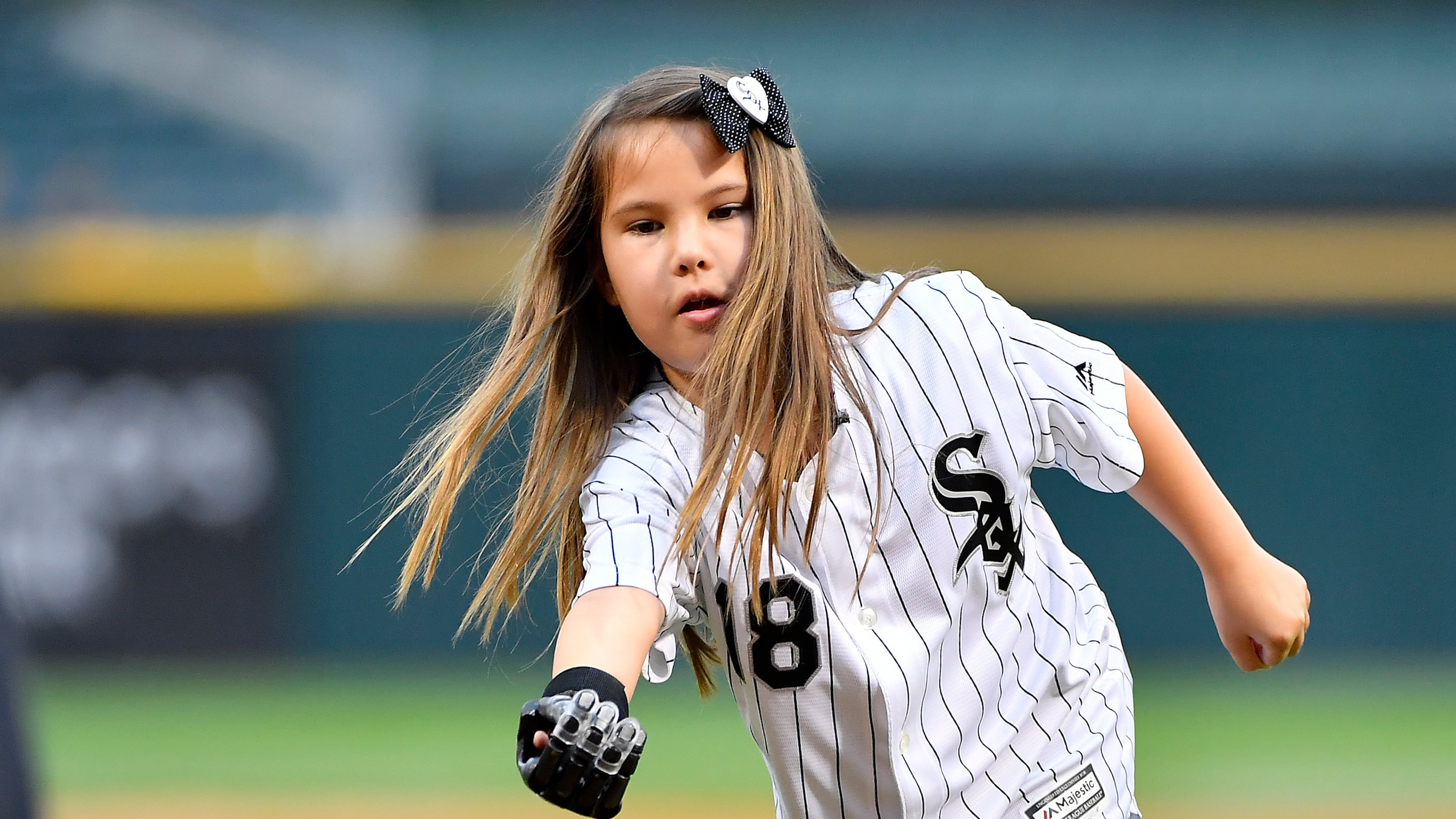 Eight-year-old Hailey Dawson throws the ceremonial first pitch before the game between the Chicago White Sox and the Cleveland Indians on June 12, 2018 at Guaranteed Rate Field in Chicago, Illinois. (Photo by Quinn Harris/Icon Sportswire via Getty Images)