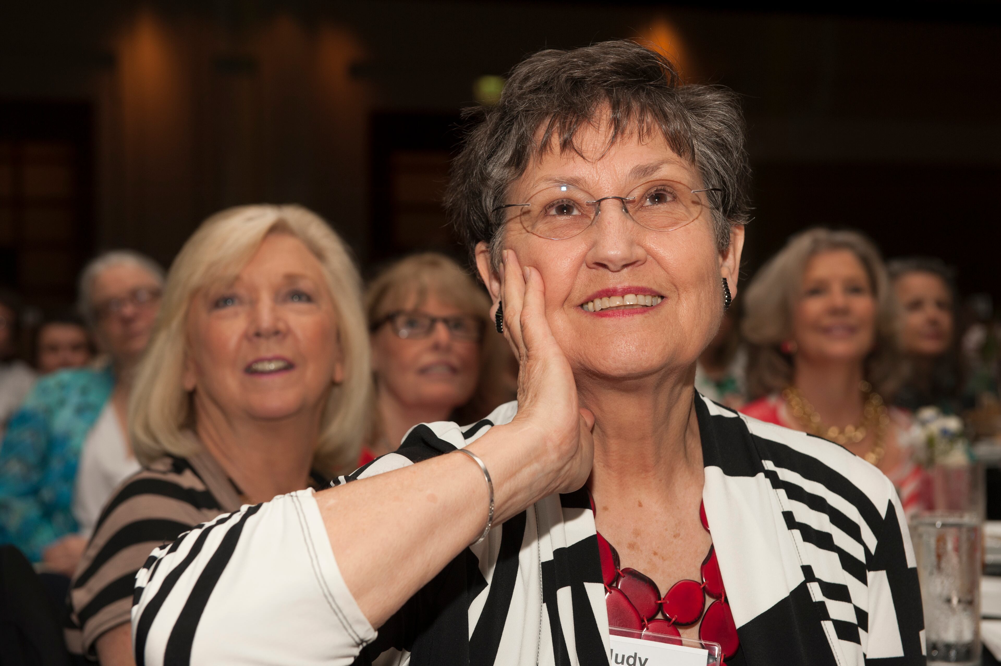 Judy Toensmier watches a winners documentary video during Celebrating Nurses AJC Jobs Nursing Excellence Awards Tuesday, May 6, 2014 at the Cobb Galleria. (Photo by Barry Williams/Special)