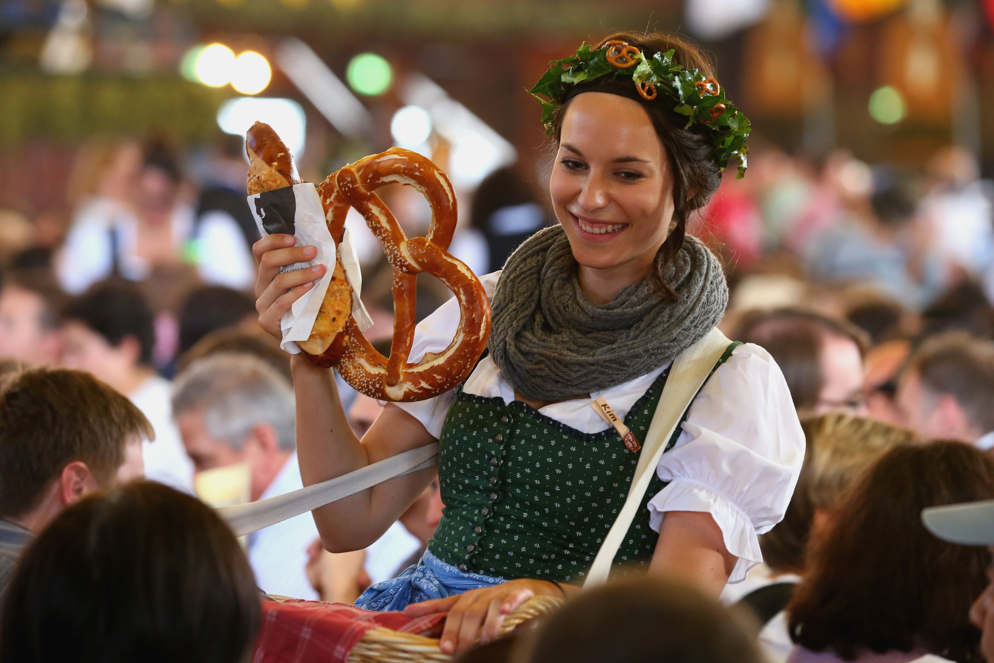 MUNICH, GERMANY - SEPTEMBER 21: A salesperson offers bavarian pretzel at Augustiner Beer tent after the Parade of Costumes and Riflemen (Trachten- und Schuetzenzug) on the second day of the 2014 Oktoberfest at Theresienhoehe on September 21, 2014 in Munich, Germany. The 181st Oktoberfest will be open to the public from September 20 through October 5 and traditionally draws millions of visitors from across the globe in the world's largest beer fest. (Photo by Alexander Hassenstein/Getty Images)