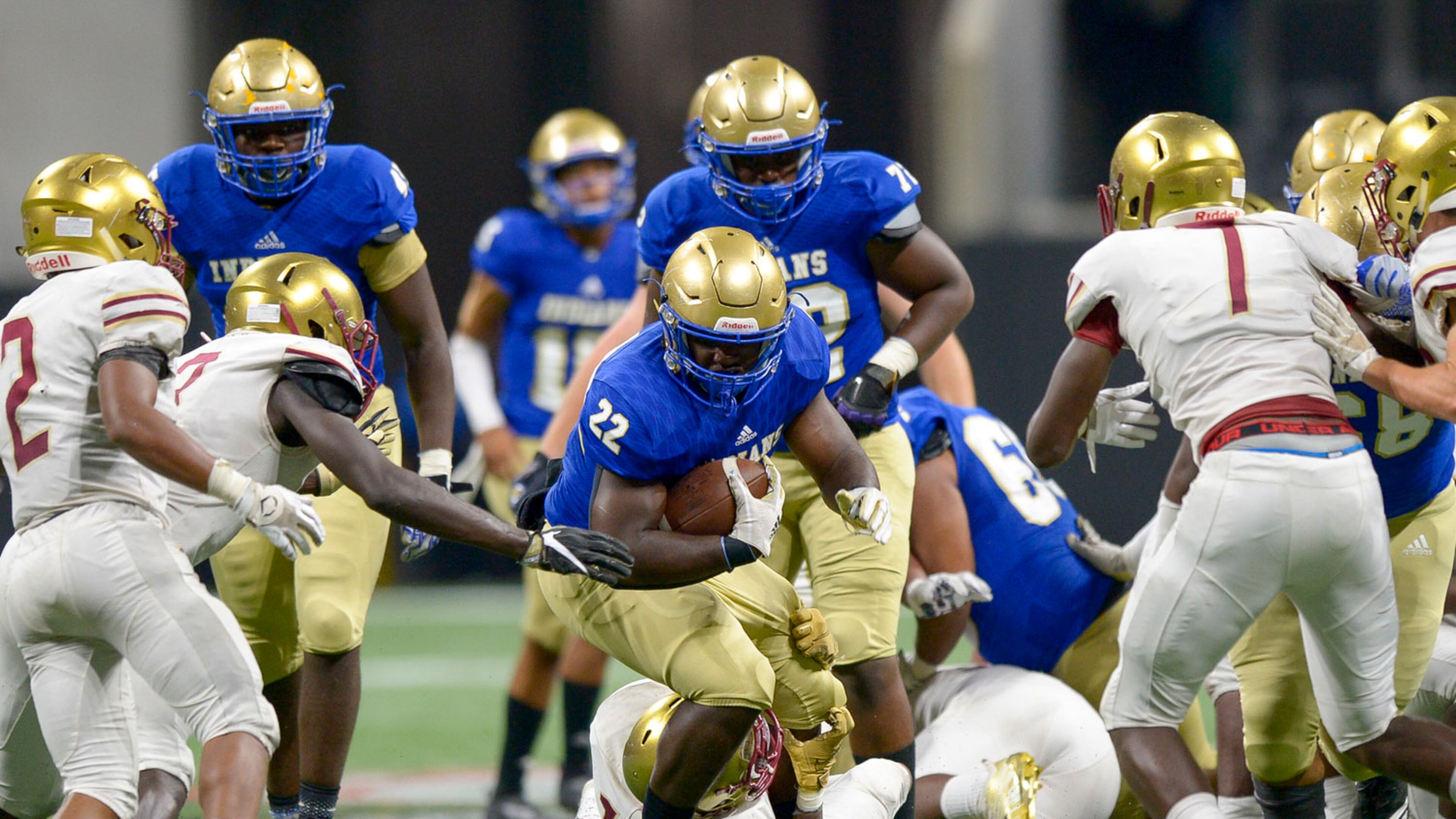 McEachern senior RB Jordon Simmons (22) gains yardage against the Brookwood defense in the second half of their game at the Mercedes Benz Stadium in Atlanta during the Corky Kell Classic Saturday, August 24, 2019. PHOTO/Daniel Varnado