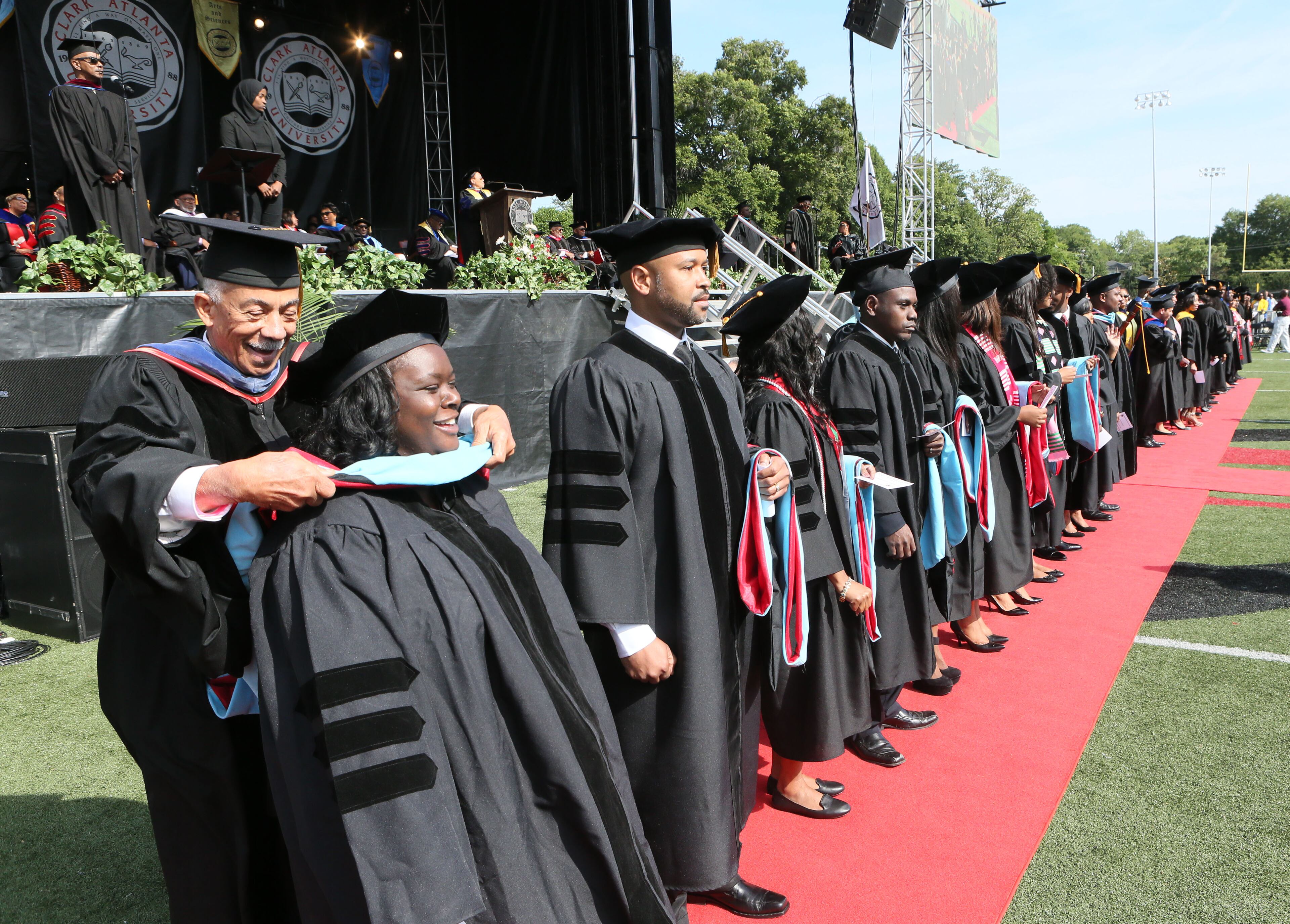 May 16, 2016 - Atlanta - Doctoral candidates are hooded prior to the distribution of diplomas. Clark Atlanta University class of 2016 filled Panther Stadium Monday morning for it's 27th annual Commencement Service. The keynote speaker was retired astronaut Mae Jemison, the first woman of color in Space. Honorary degrees were awarded to Hamilton Bohannon, a 1964 graduate of Clark College; Roland Carter; Congressman John Conyers, and Congressman Hank Johnson, a 1976 Clark College graduate. BOB ANDRES / BANDRES@AJC.COM