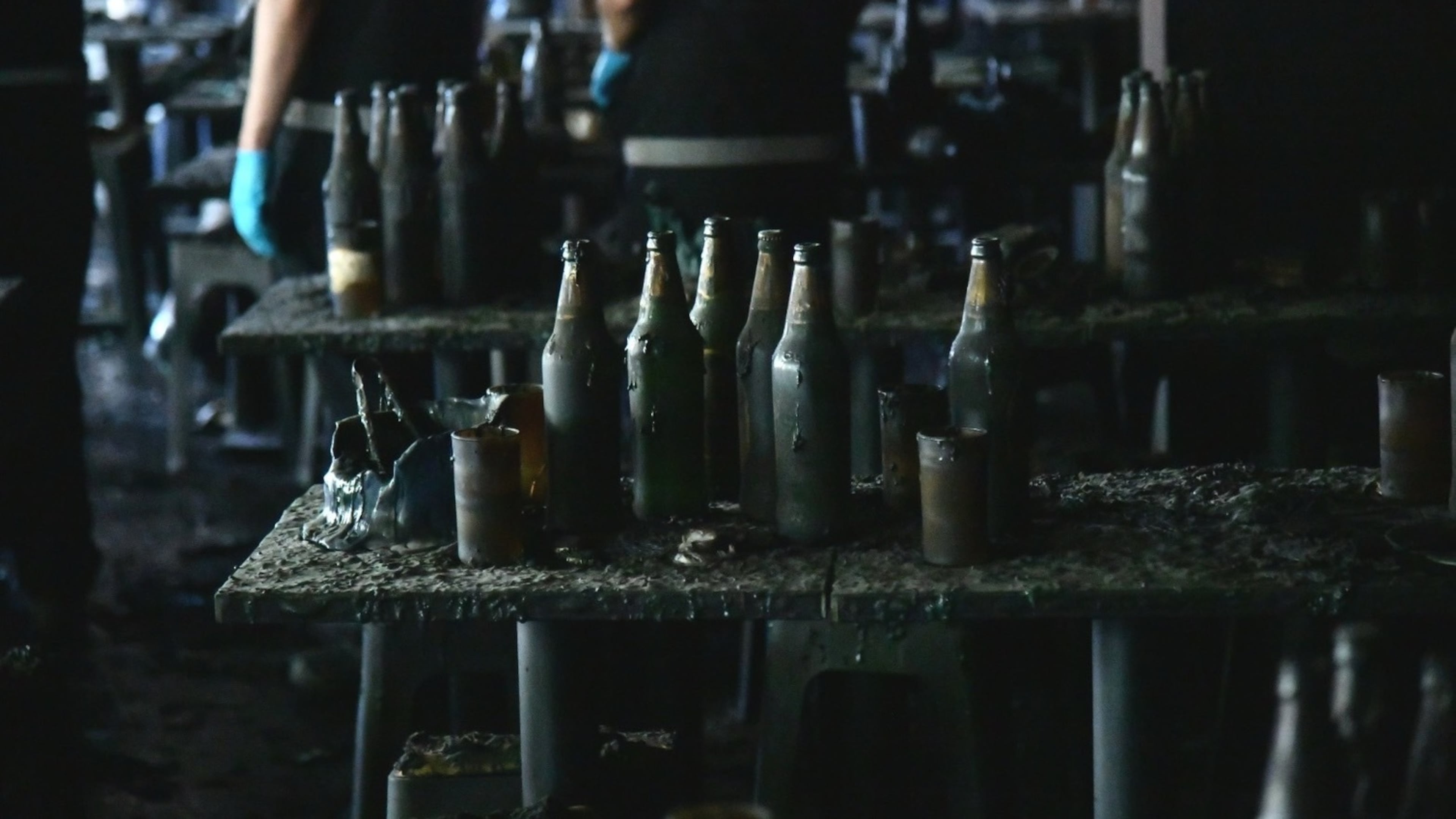 In this handout photo released by Bangkok Metropolitan Administration, bottles are seen on a table at the site of a fire in Bangkok, Thailand, Monday, July 13, 2026. (Bangkok Metropolitan Administration via AP)