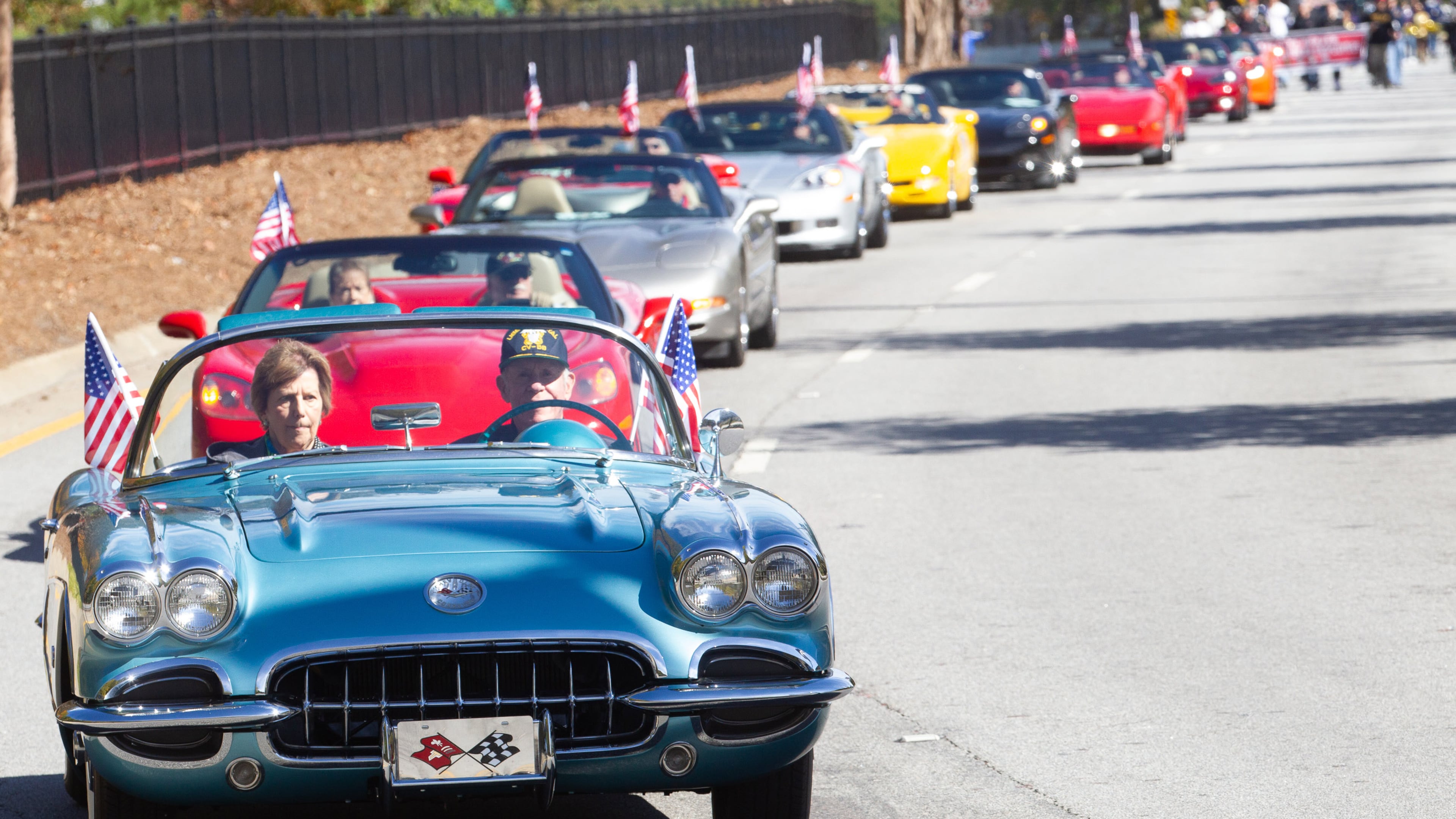 Don Nugent and his wife, Carolyn, lead a long line of flag-bearing Corvettes during the 40th annual Georgia Veterans Day Parade at The Battery in Cobb County on Saturday, November 6, 2021. (Photo: Steve Schaefer for The Atlanta Journal-Constitution)