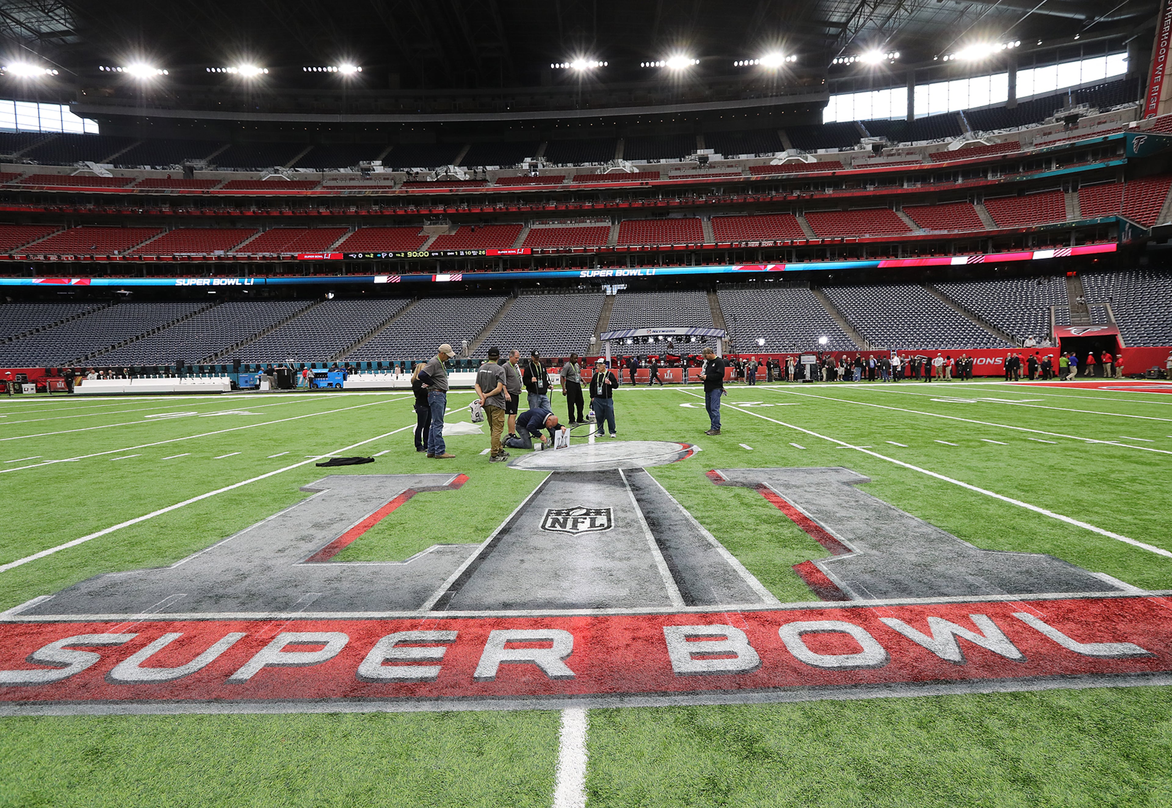 February 5, 2017, Houston: Ed Mangan, Atlanta, puts the finishing touch on the field for the start of the Super Bowl in NRG Stadium on Sunday Feb. 5, 2017, in Houston.