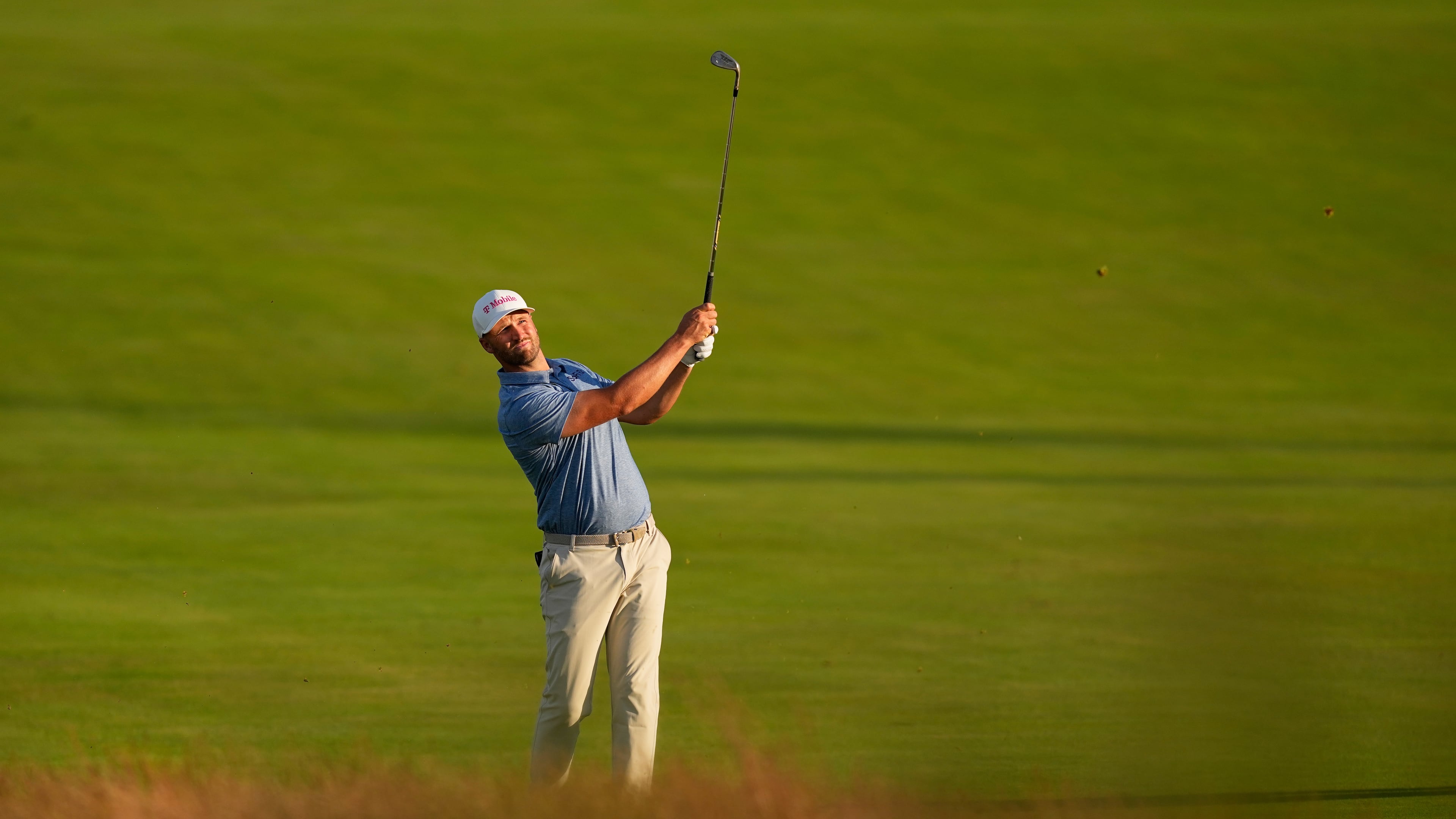 Wyndham Clark hits from the fairway on the third hole during the first round of the U.S. Open golf tournament at Shinnecock Hills Golf Club in Southampton, N.Y., Thursday, June 18, 2026.(AP Photo/David J. Phillip)