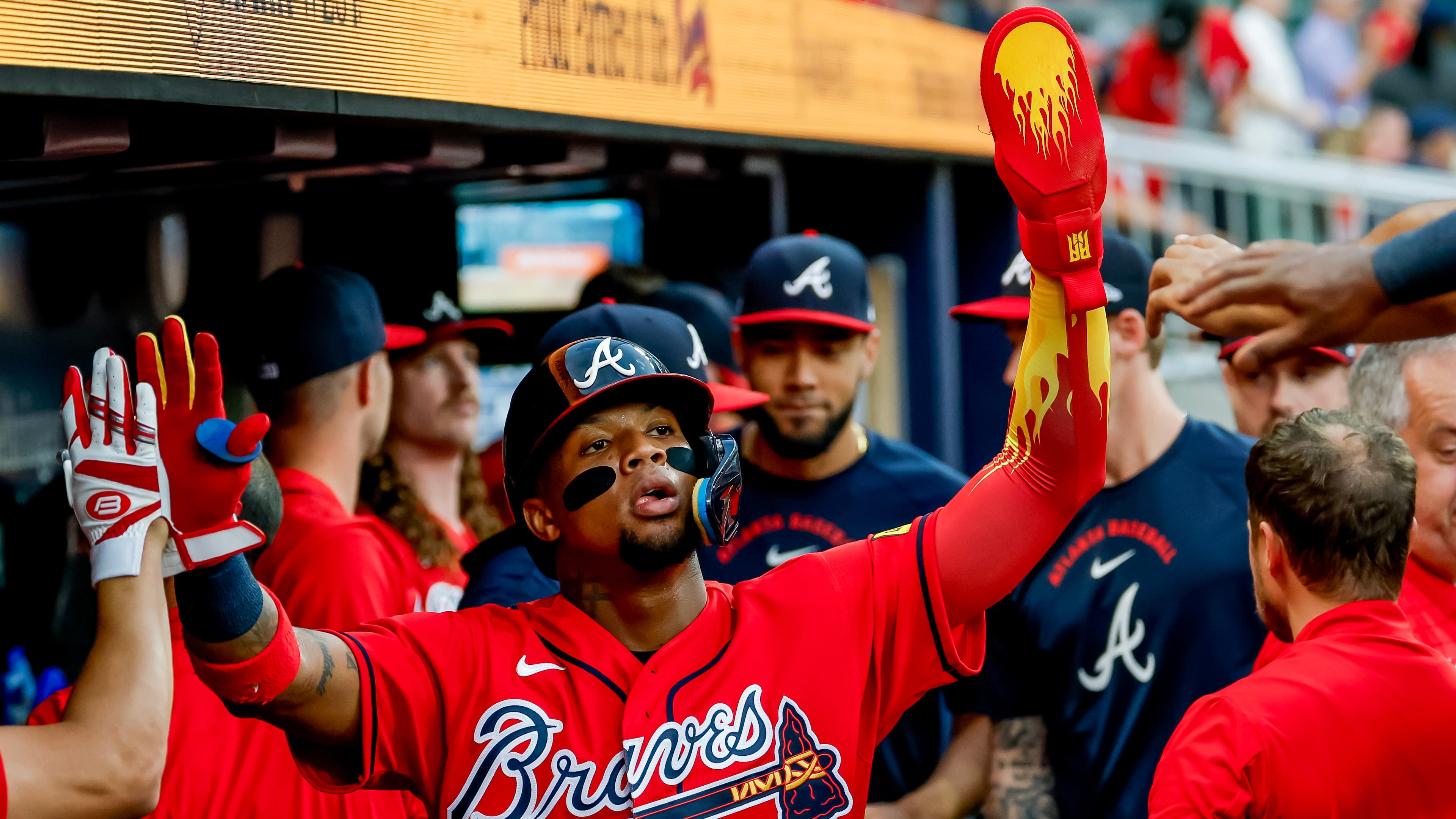 Atlanta Braves' Ronald Acuña Jr., center, is greeted in the dugout after scoring against the Colorado Rockies during the second inning of a baseball game, Friday, Aug. 28, 2026, in Atlanta. (Erik S. Lesser/AP)