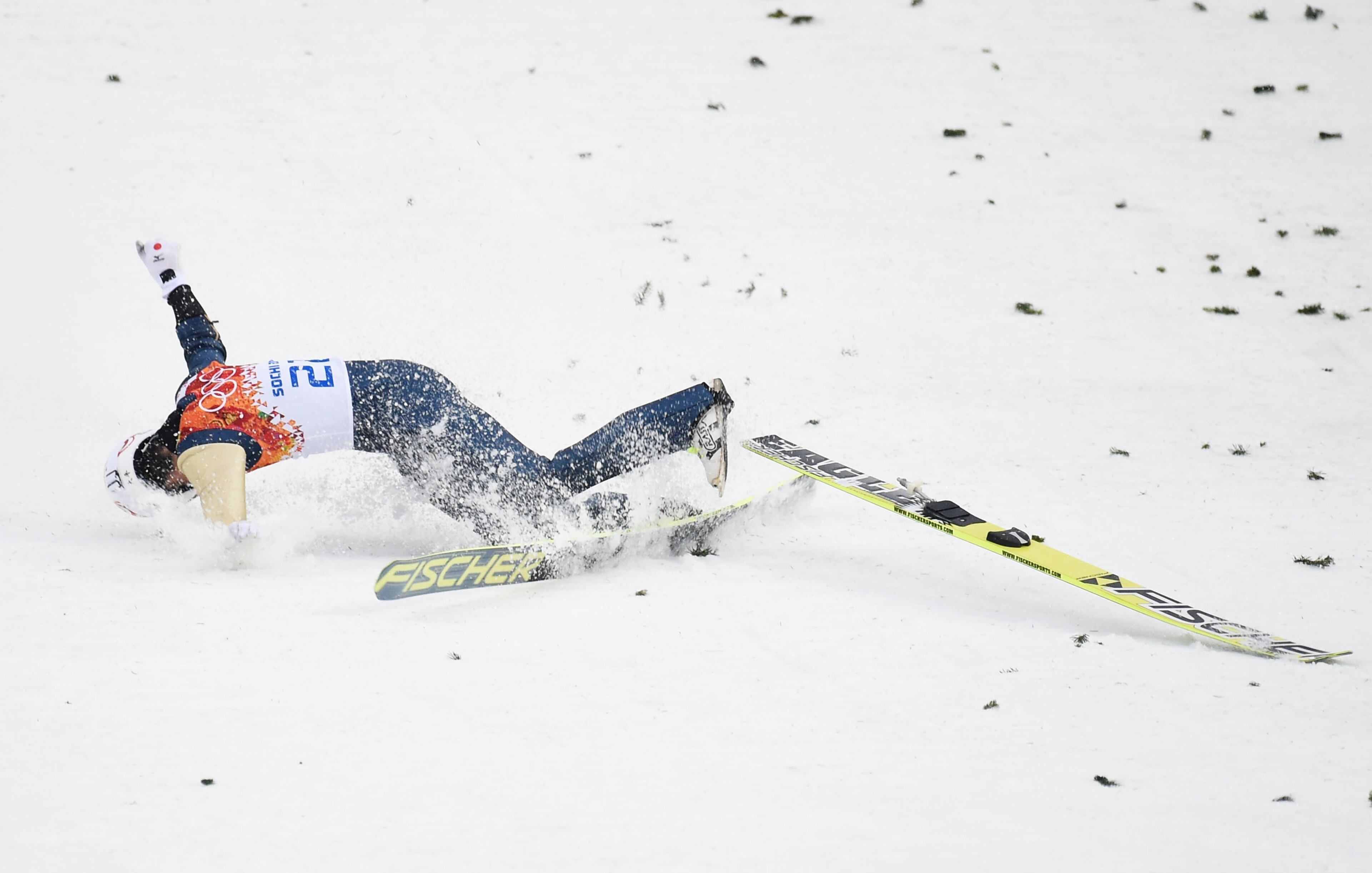 Taihei Kato of Japan crashes as he competes in the Nordic Combined Men's Individual LH during day 11 of the Sochi 2014 Winter Olympics at RusSki Gorki Jumping Center on February 18, 2014 in Sochi, Russia.