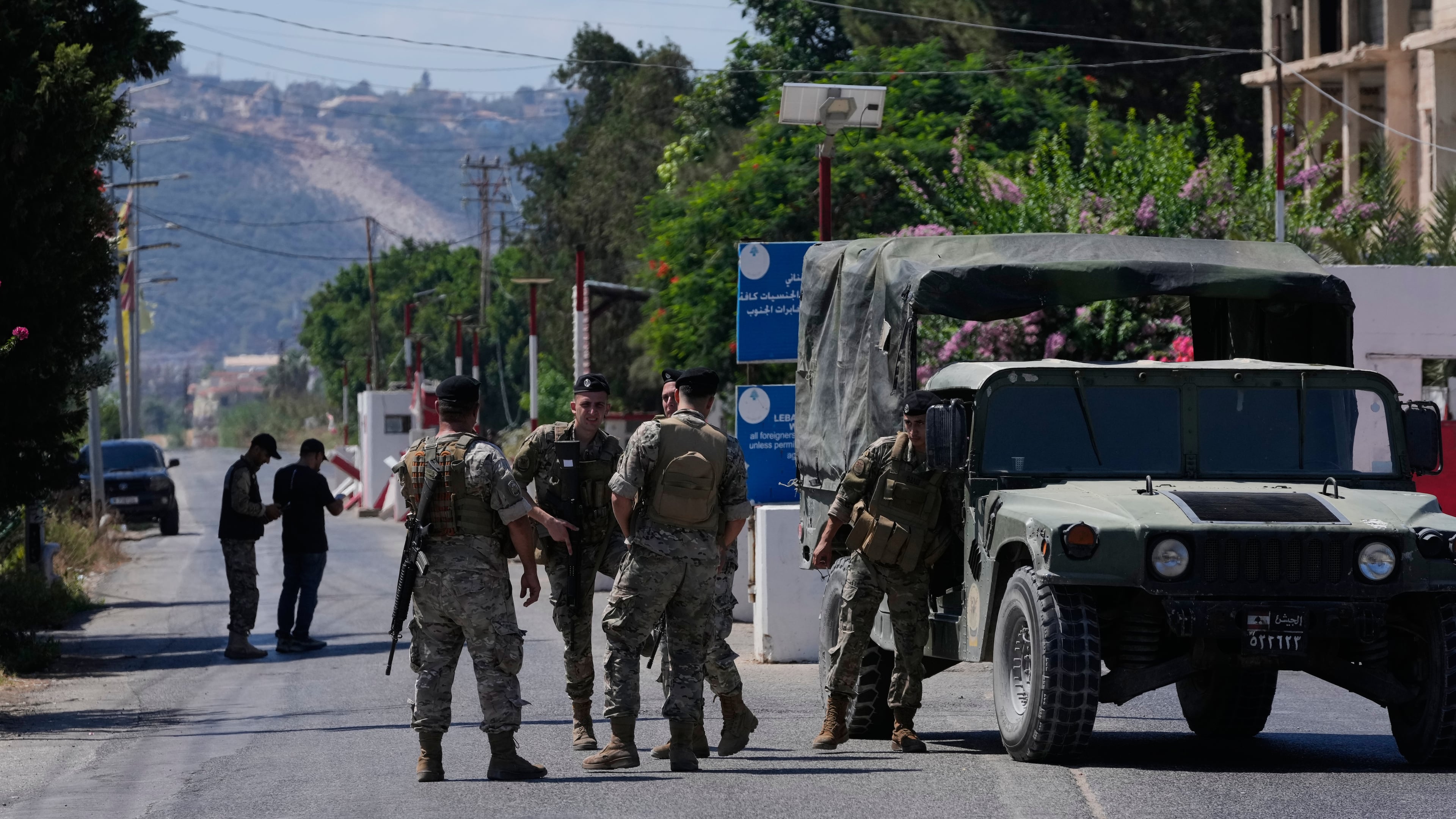 Lebanese army soldiers stand guard at a checkpoint near the border with Israel in the southern village of Mansouri, Lebanon, Friday, Sept. 4, 2026. (AP Photo/Mohammed Zaatari)
