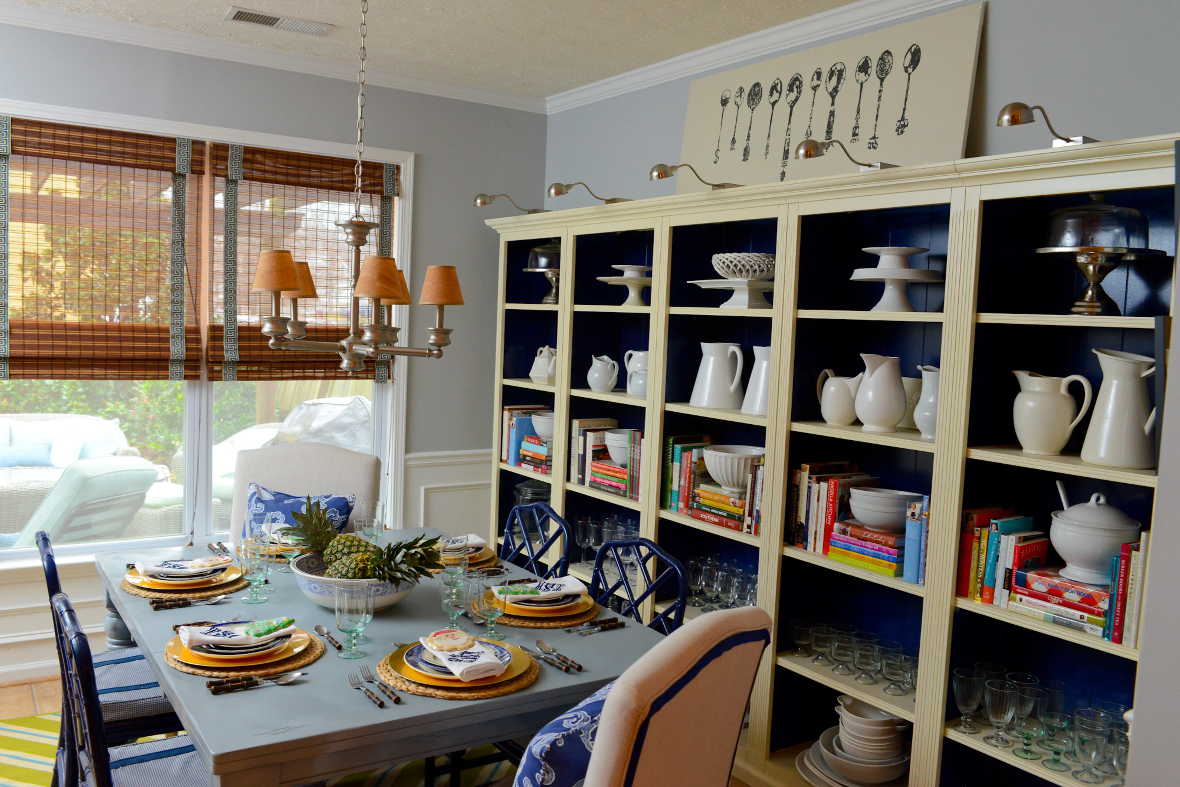 Facing a blank 12-foot wall and not enough depth to accommodate a buffet and the dining table, homeowner and designer Travis Snyder chose a bookcase from Ballard Designs to fill the empty space and still provide ample storage. "That was a splurge piece, " he says. "To me, it looks like a built-in." Text by Lori Johnston and Keith Still/Fast Copy News Service