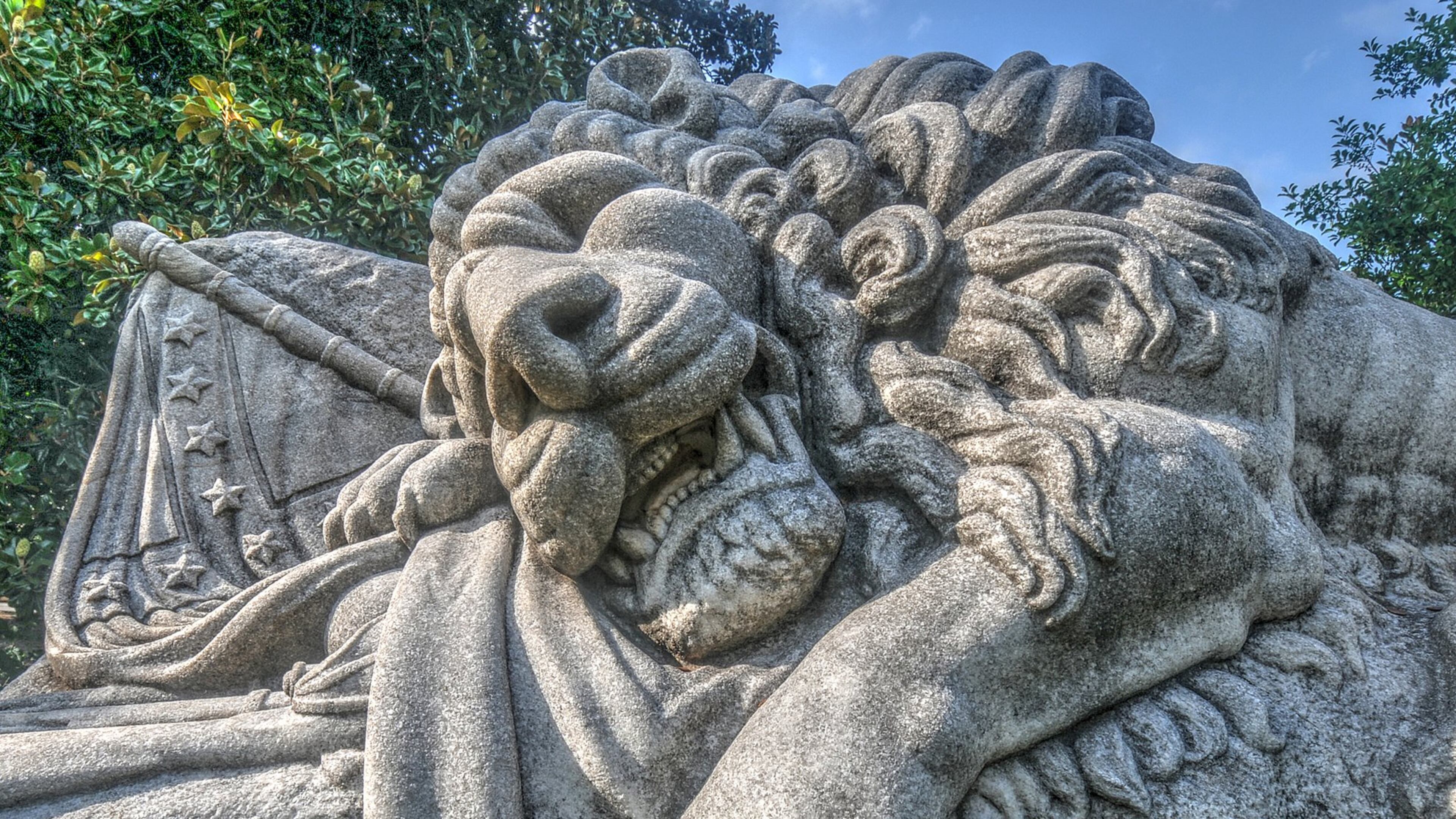 The Lion of Atlanta, or The Lion of the Confederacy by T. M. Brady commissioned in 1894 and carved from one of the largest pieces of Georgia marble quarried at the time, guards a field of unknown Confederate dead in Oakland Cemetery. The memorial statue was commissioned by the Atlanta Ladies Memorial Association and is part of the Oakland Cemetery Civil War Tour.