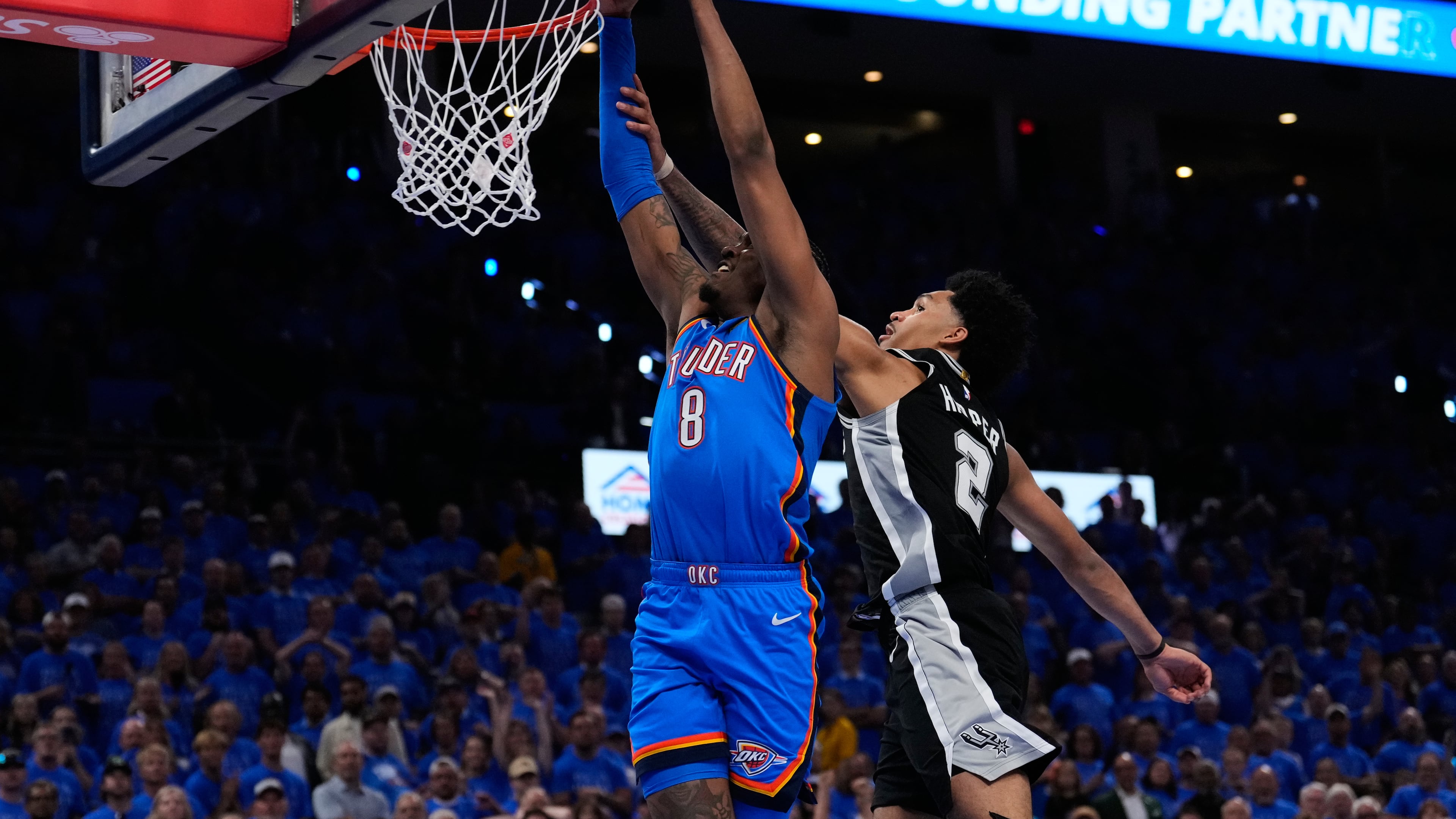 Oklahoma City Thunder guard Jalen Williams (8) shoots against San Antonio Spurs guard Dylan Harper (2) during overtime of Game 1 in a third-round NBA basketball playoffs series Monday, May 18, 2026, in Oklahoma City. (AP Photo/Tony Gutierrez)