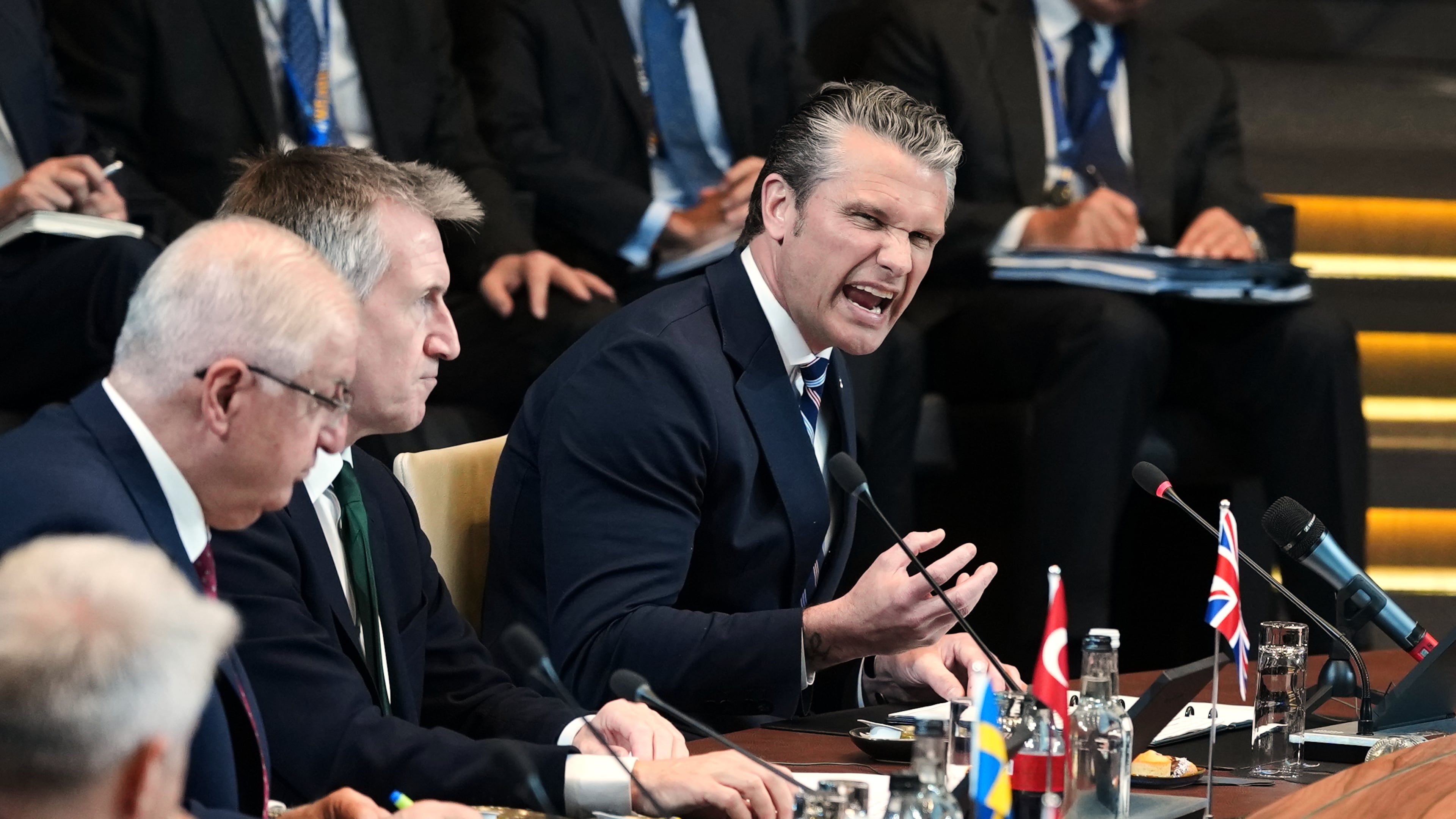 United States Defense Secretary Pete Hegseth, right, speaks during a meeting of the North Atlantic Council in defense ministers format at NATO headquarters in Brussels, Thursday, June 18, 2026. (AP Photo/Virginia Mayo)