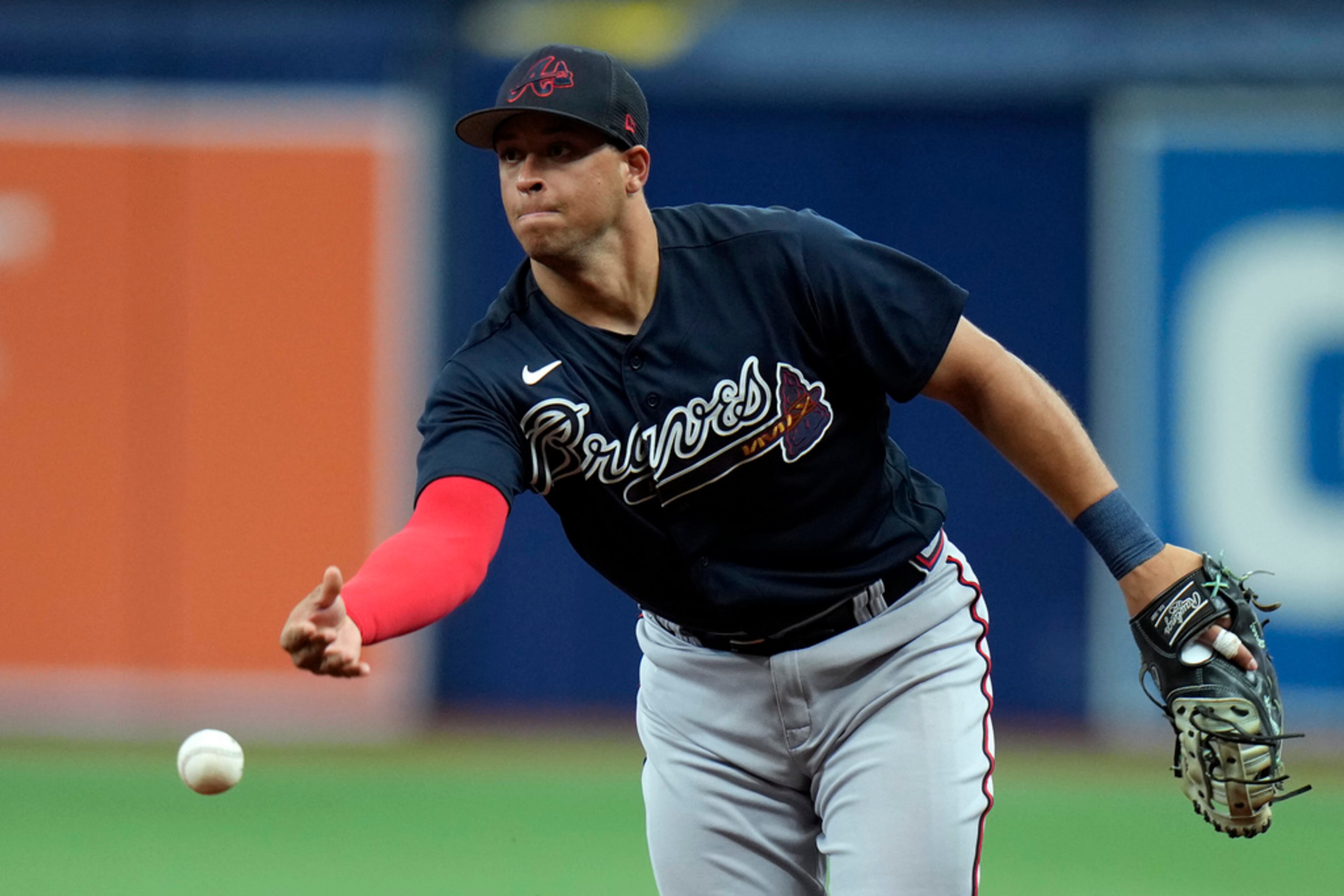 Atlanta Braves first baseman Joe Dunand flips the ball to pitcher Ian Anderson in time to get Tampa Bay Rays' Vidal Brujan at first during the fourth inning of a spring training baseball game Friday, March 10, 2023, in St. Petersburg, Fla. (AP Photo/Chris O'Meara)