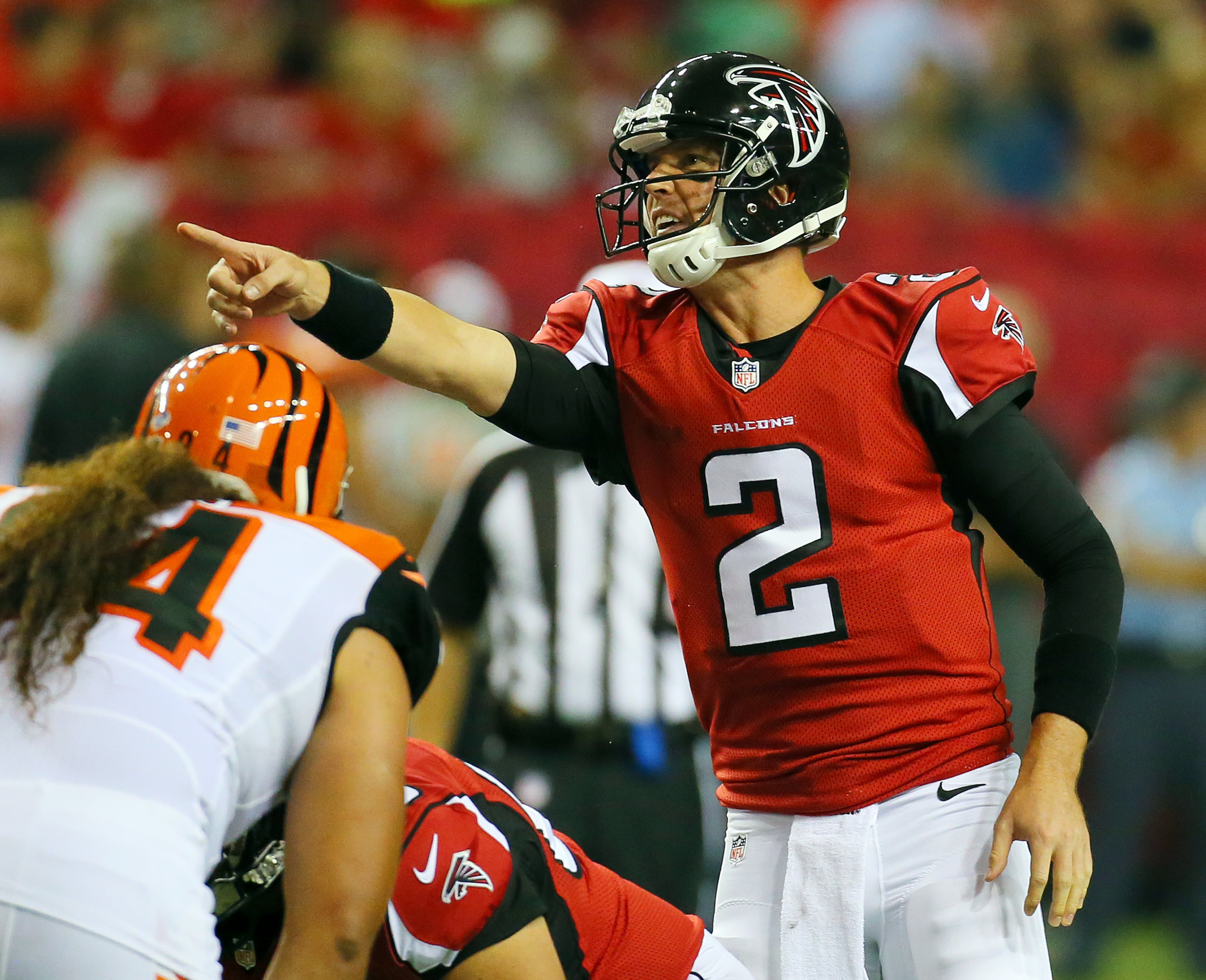 Matt Ryan points out the defensive coverage and audibles a play at the line of scrimmage against the Bengals during the first quarter of their NFL exhibition game on Thursday, Aug. 8, 2013, in Atlanta.