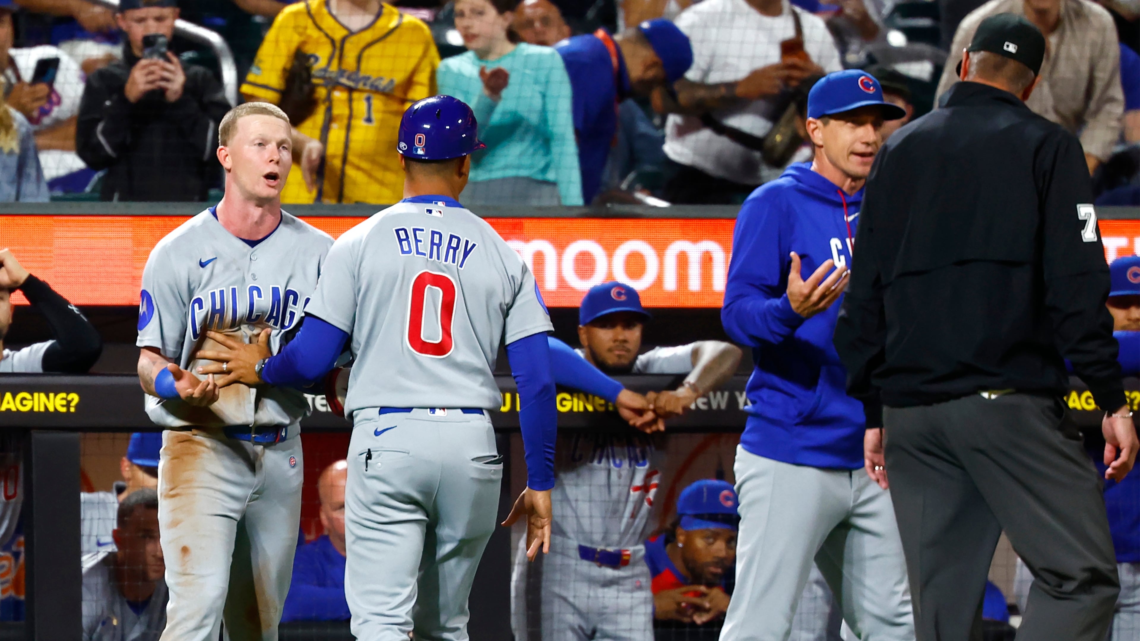 Chicago Cubs' center fielder Pete Crow-Armstrong, left, and manager Craig Counsell, right, argue with umpire Jordan Baker (71) during the seventh inning of a baseball game against the New York Mets, Tuesday, June 23, 2026, in New York. (AP Photo/Noah K. Murray)
