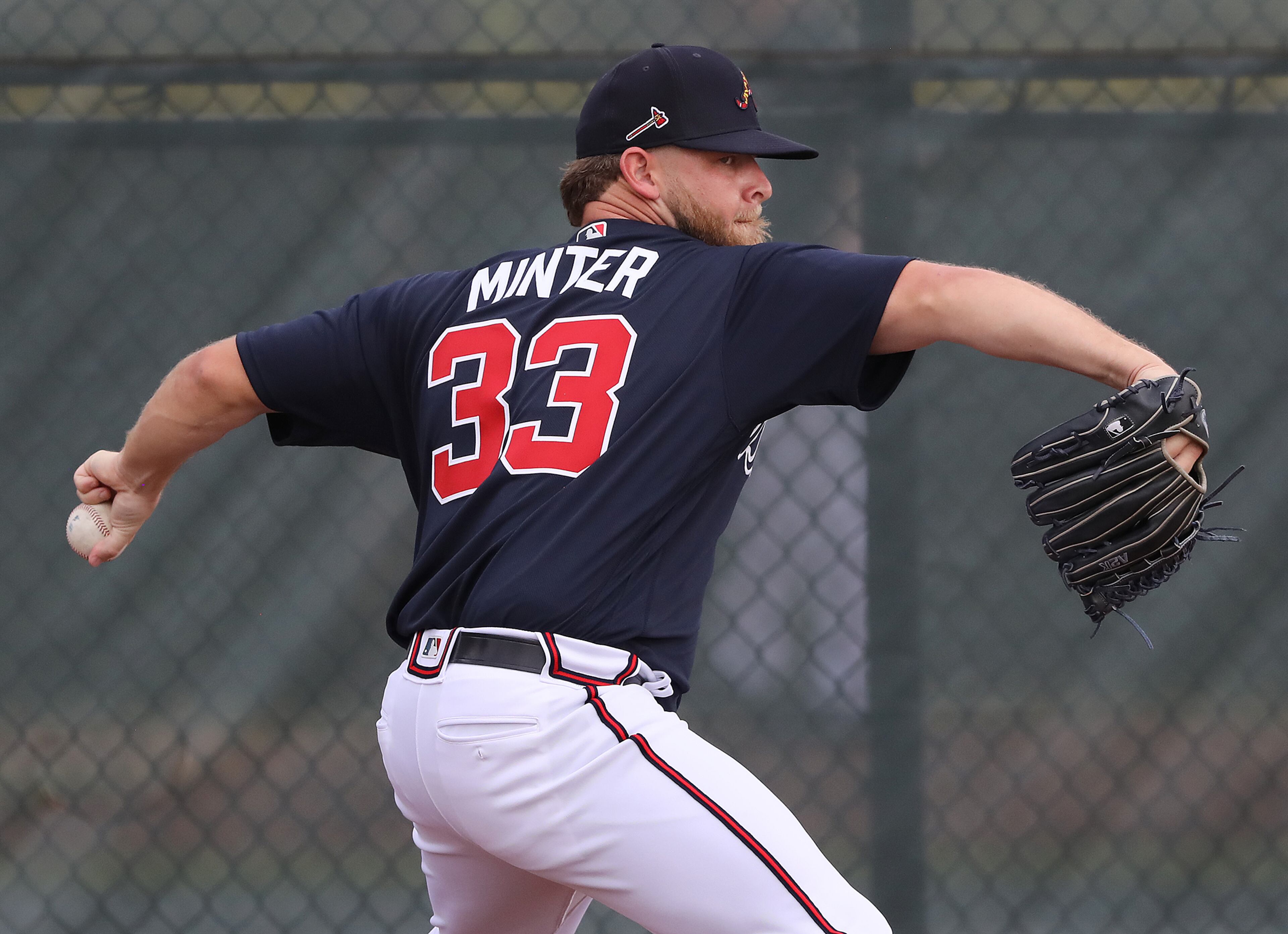 Braves pitcher A.J. Minter delivers a pitch during spring training on Friday, Feb. 14, 2020, in North Port. Curtis Compton ccompton@ajc.com