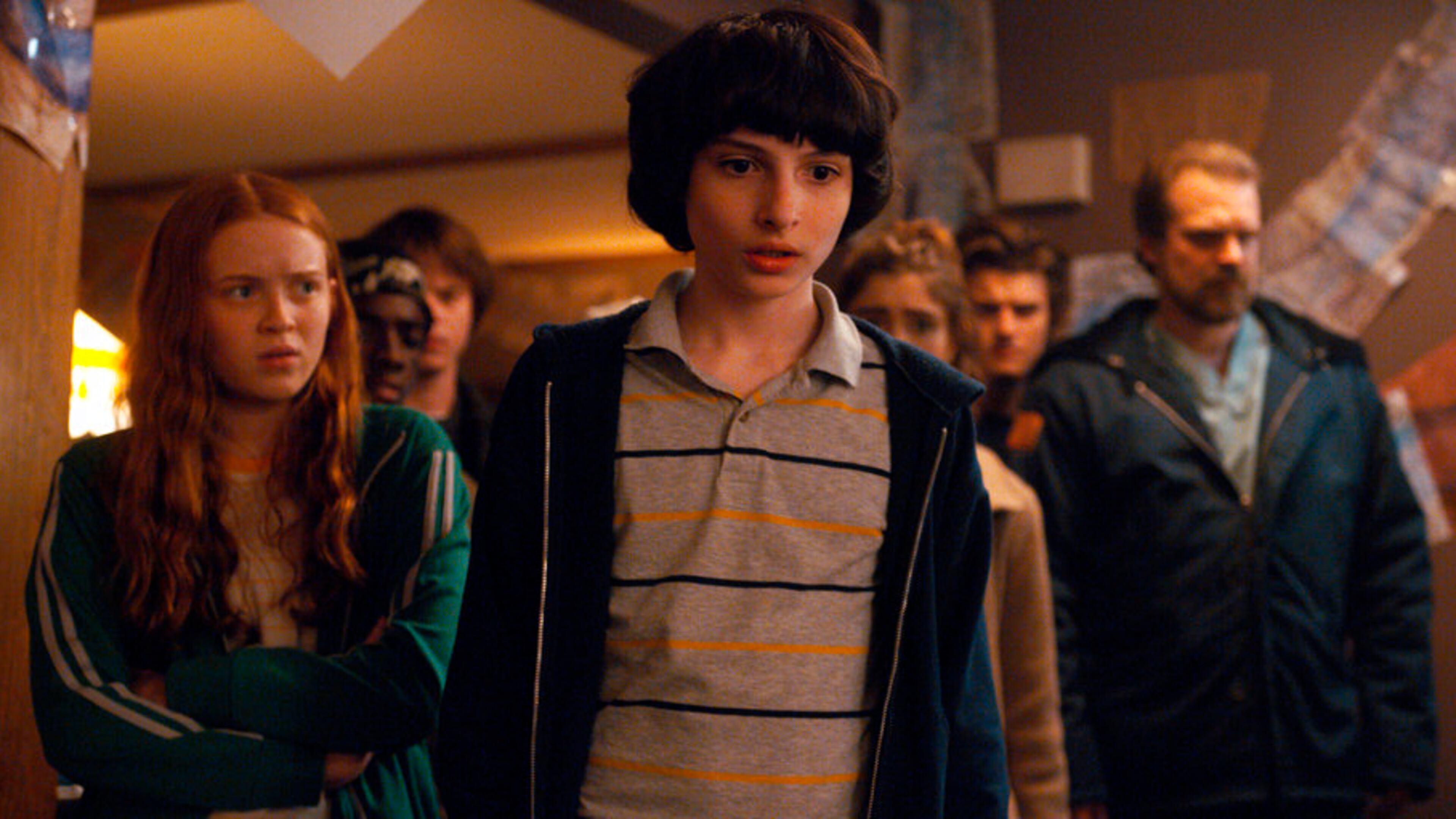 This image released by Netflix shows, from left, Sadie Sink, Charlie Heaton, Finn Wolfhard, Natalia Dyer, Joe Keery and David Harbour in a scene from "Stranger Things 2." (Netflix via AP)