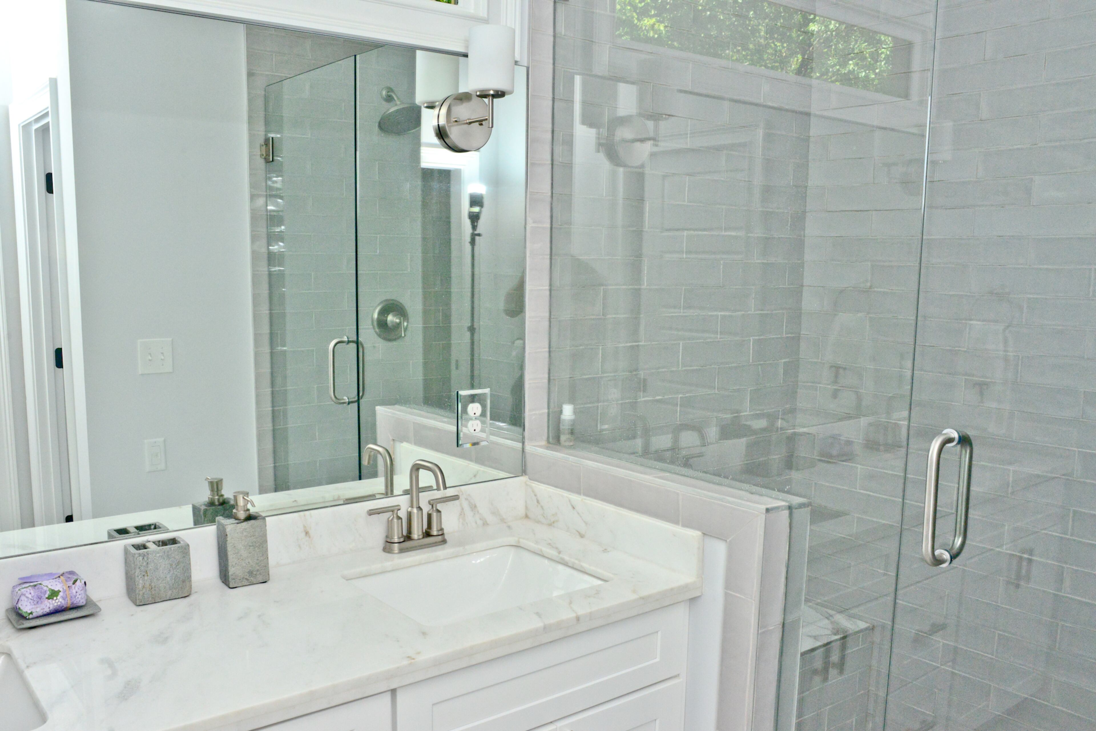 Homeowners Megan Isom and Taqqee Id-Deen worked closely with builder Stryant Construction during the renovation, including customizing their home with upgrades like the master bathroom countertop from Floor and Decor.