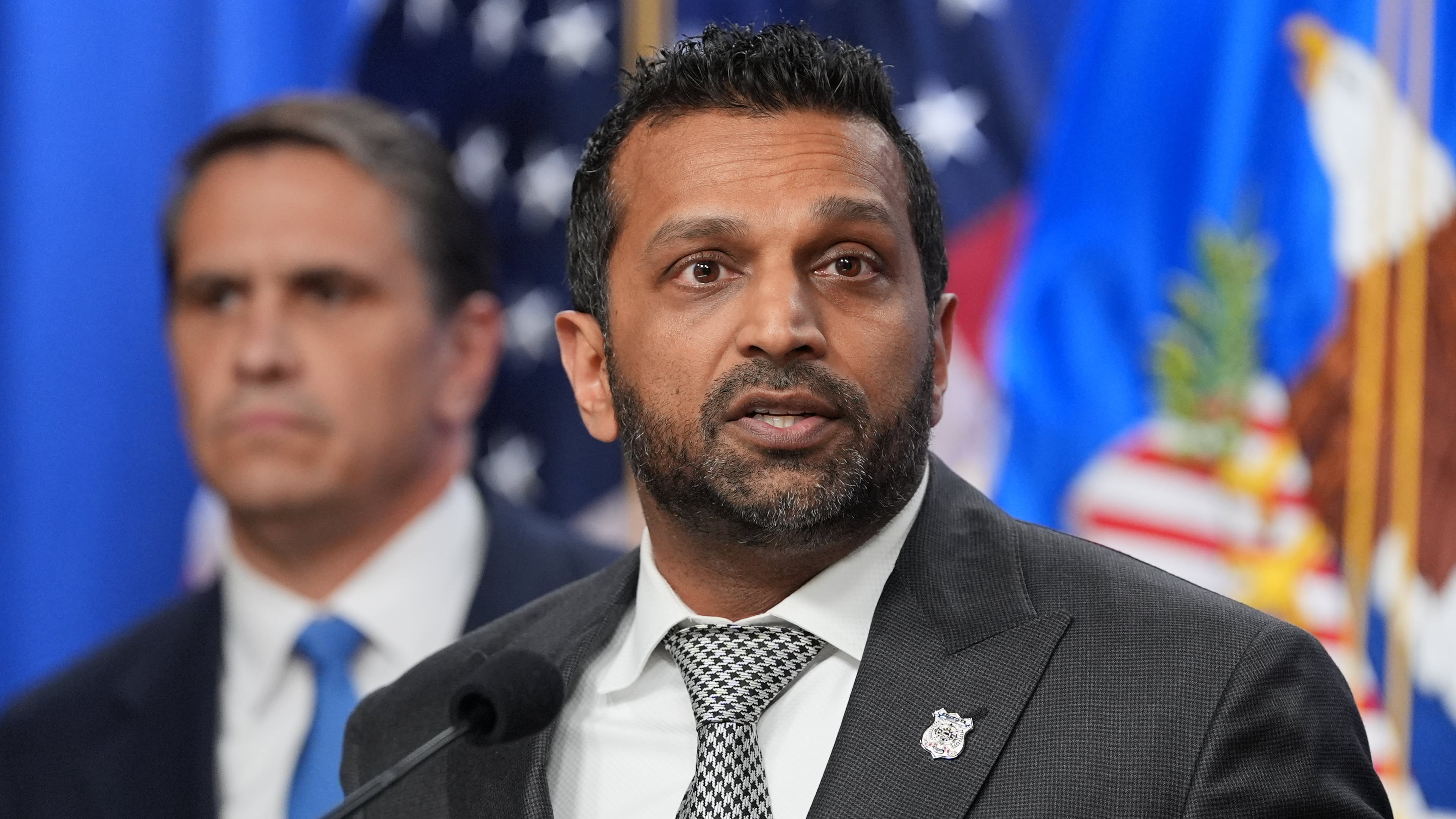 Acting Attorney General Todd Blanche listens as FBI Director Kash Patel speaks during a news conference at the Justice Department, Tuesday, April 21, 2026, in Washington. (AP Photo/Jacquelyn Martin)