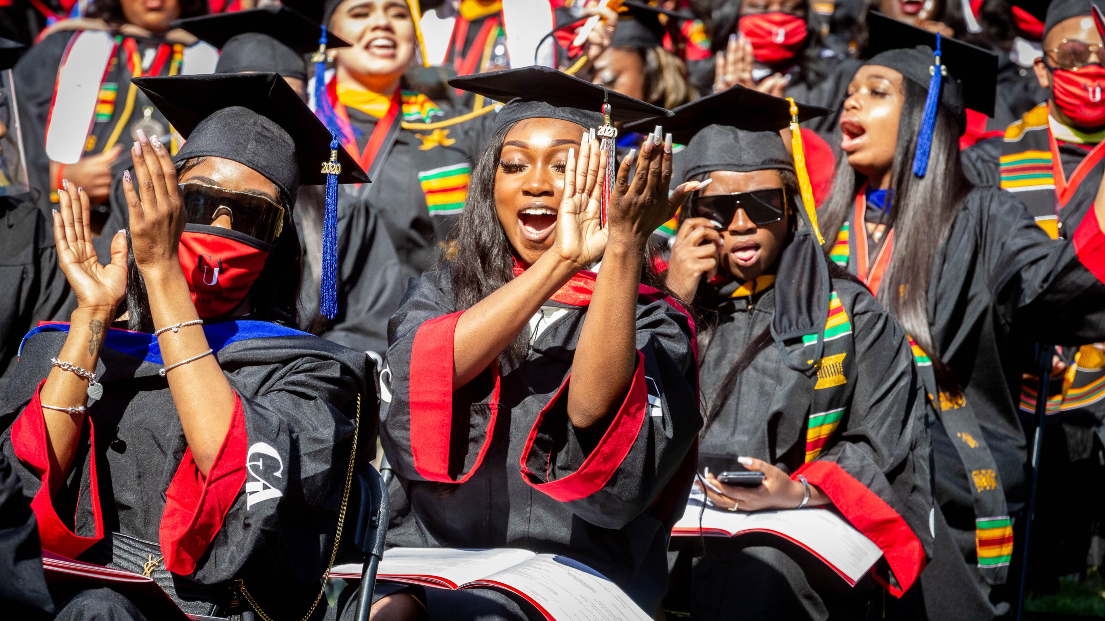 Members of the Clark Atlanta University 2020 graduating class celebrate during the Saturday ceremony at the Harkness Hall Quadrangle in Atlanta May 15, 2021. The 2020 ceremony was postponed because of the COVID-19 pandemic. (Photo: Steve Schaefer for The Atlanta Journal-Constitution)