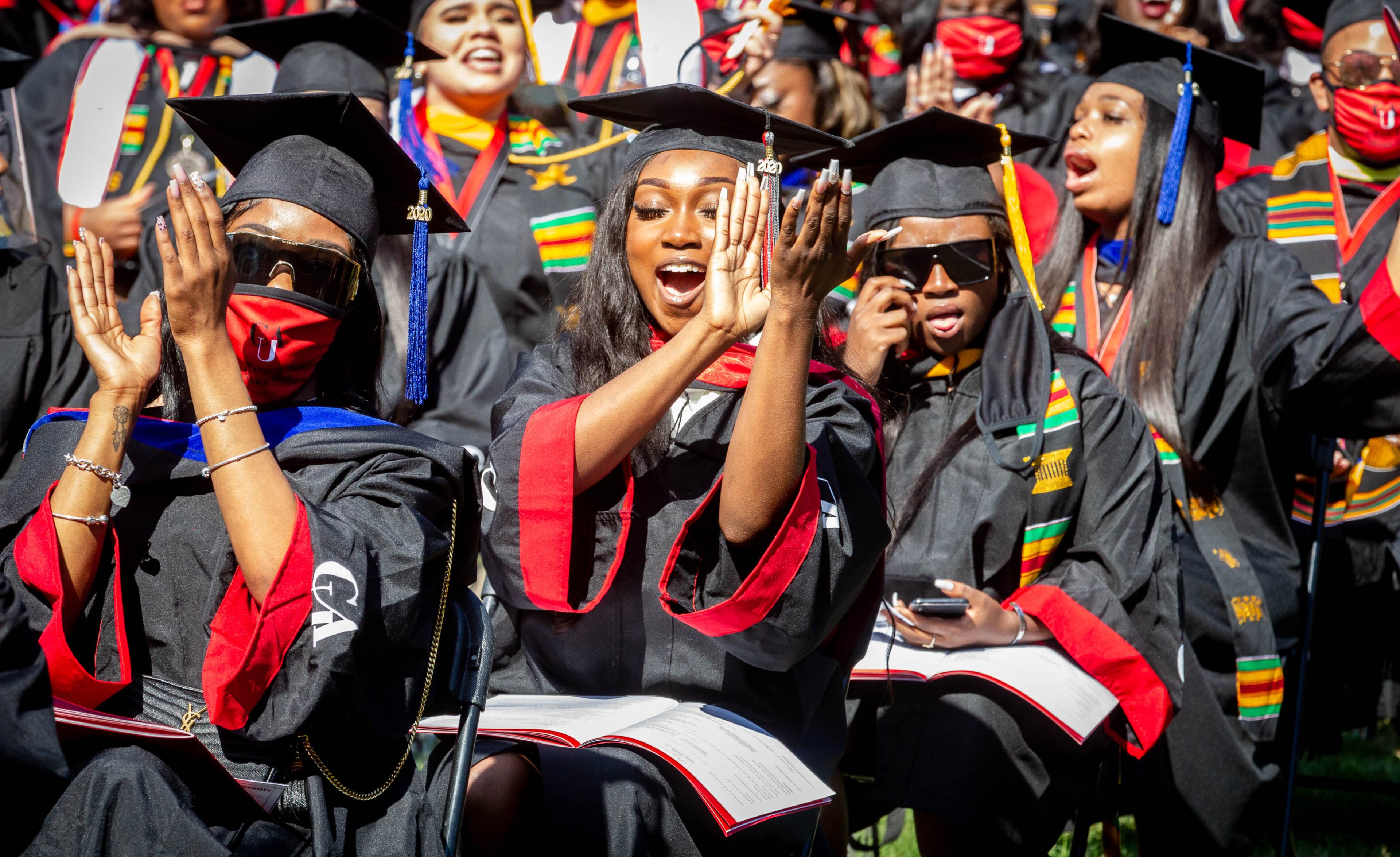 Members of the Clark Atlanta University 2020 graduating class celebrate during the Saturday ceremony at the Harkness Hall Quadrangle in Atlanta May 15, 2021. The 2020 ceremony was postponed because of the COVID-19 pandemic. (Photo: Steve Schaefer for The Atlanta Journal-Constitution)