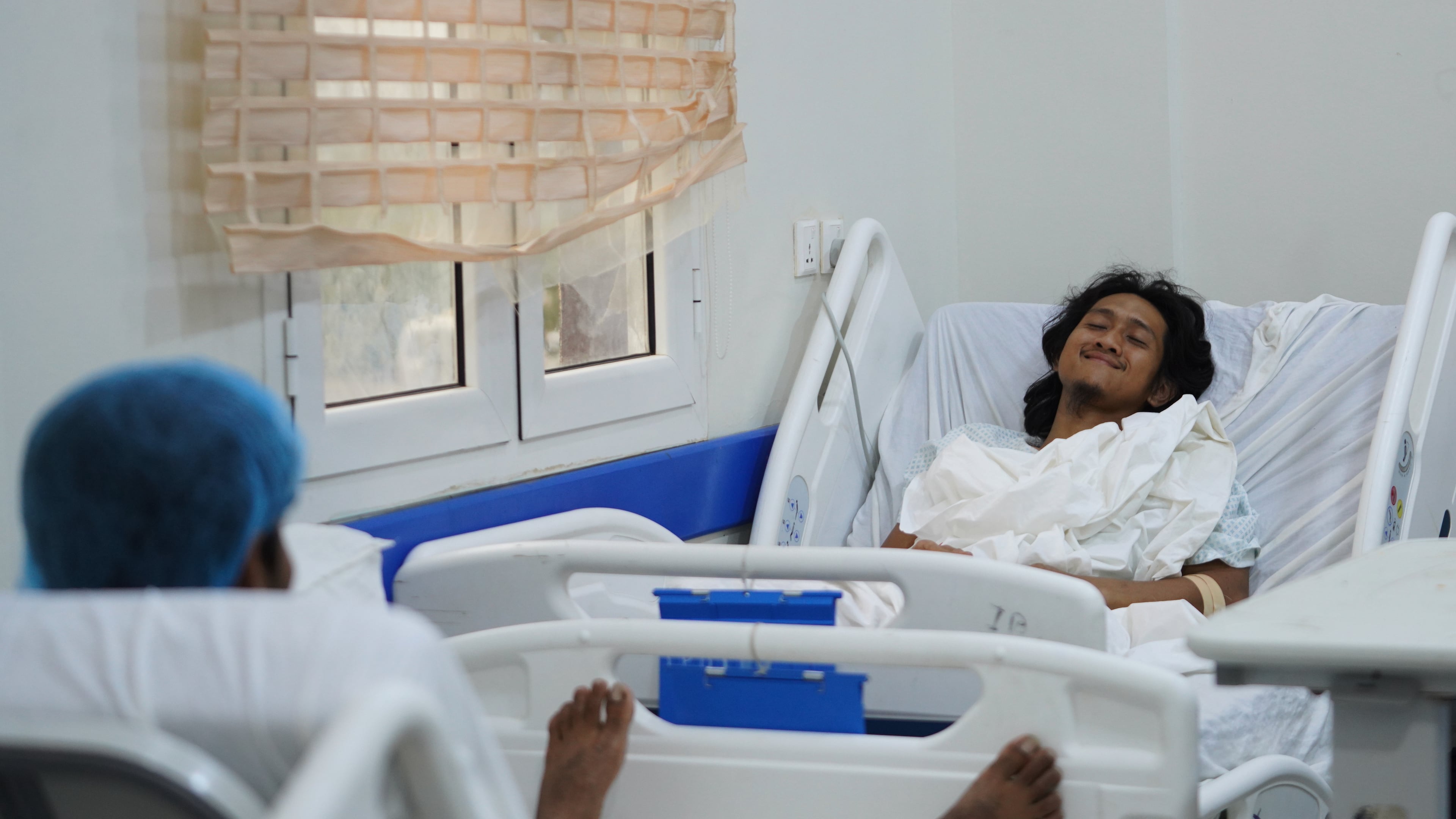 Indonesian crew member Muhammad Al Taindo , right, receives medical treatment at 2 December Hospital in Mokha, Yemen, Wednesday, Aug. 12, 2026, after the cargo ship Tihama was struck in a Houthi attack in the Bab al-Mandab Strait off Yemen's Dhubab district on Aug. 10, 2026. (AP Photo/Abdulnasser Alseddik)