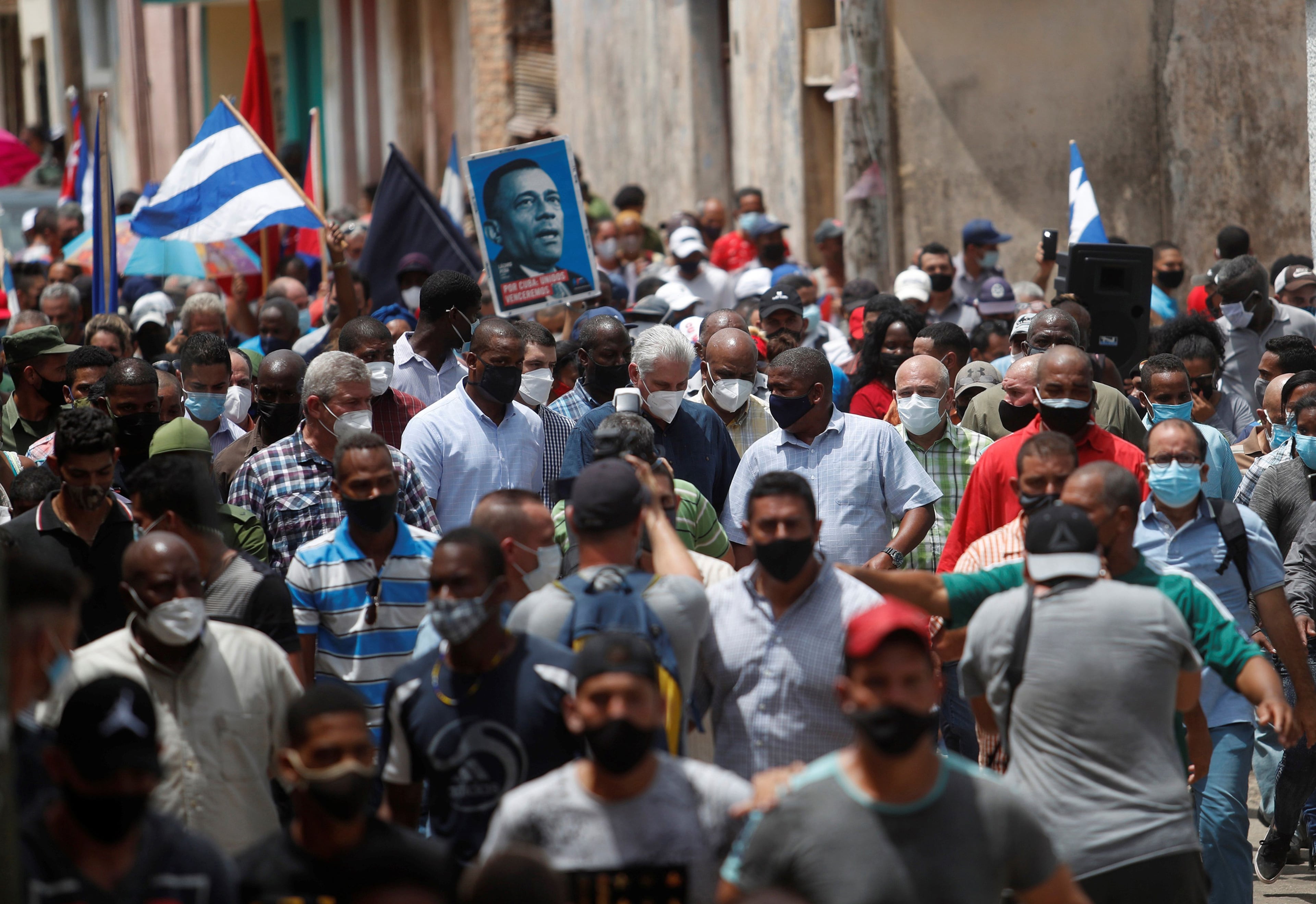 Cuban President Miguel Diaz-Canel, center, walks accompanied by supporters in San Antonio de los Banos, about 22 miles from Havana, Cuba. Diaz-Canel called on his supporters to take to the streets in response to protests against his governement. Hundreds of Cuban took the streets this Sunday, July 11, 2021 to demonstrate against Cuba's government. (Yander Zamora/EFE/Zuma Press/TNS)