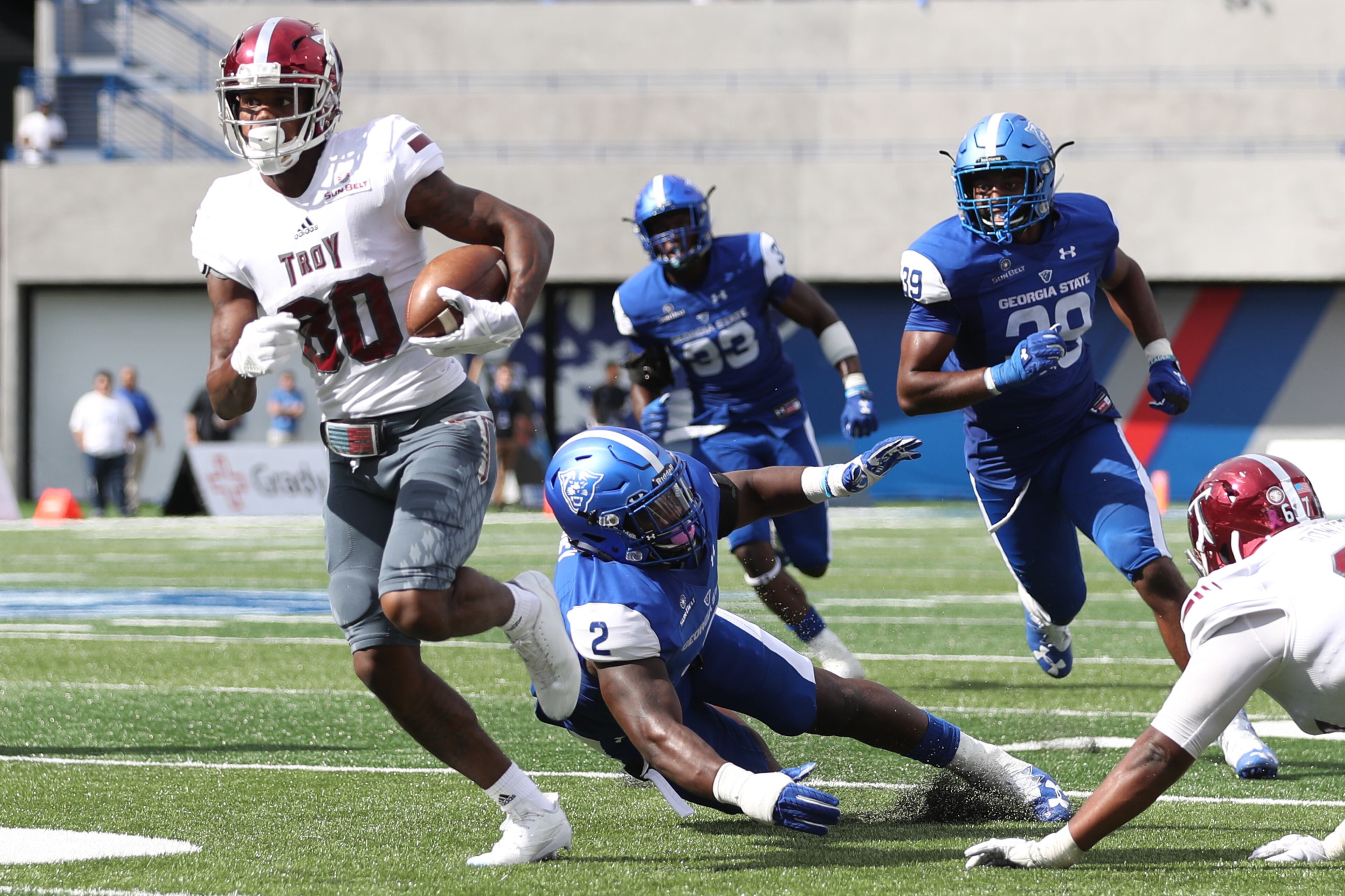 October 21, 2017 - Atlanta, Ga: Troy Trojans wide receiver Deondre Douglas (80) runs past Georgia State Panthers linebacker Ed Curney (2) for a 35-yard touchdown in the second quarter of their game at GSU Stadium Saturday, October 21, 2017, in Atlanta.. PHOTO / JASON GETZ