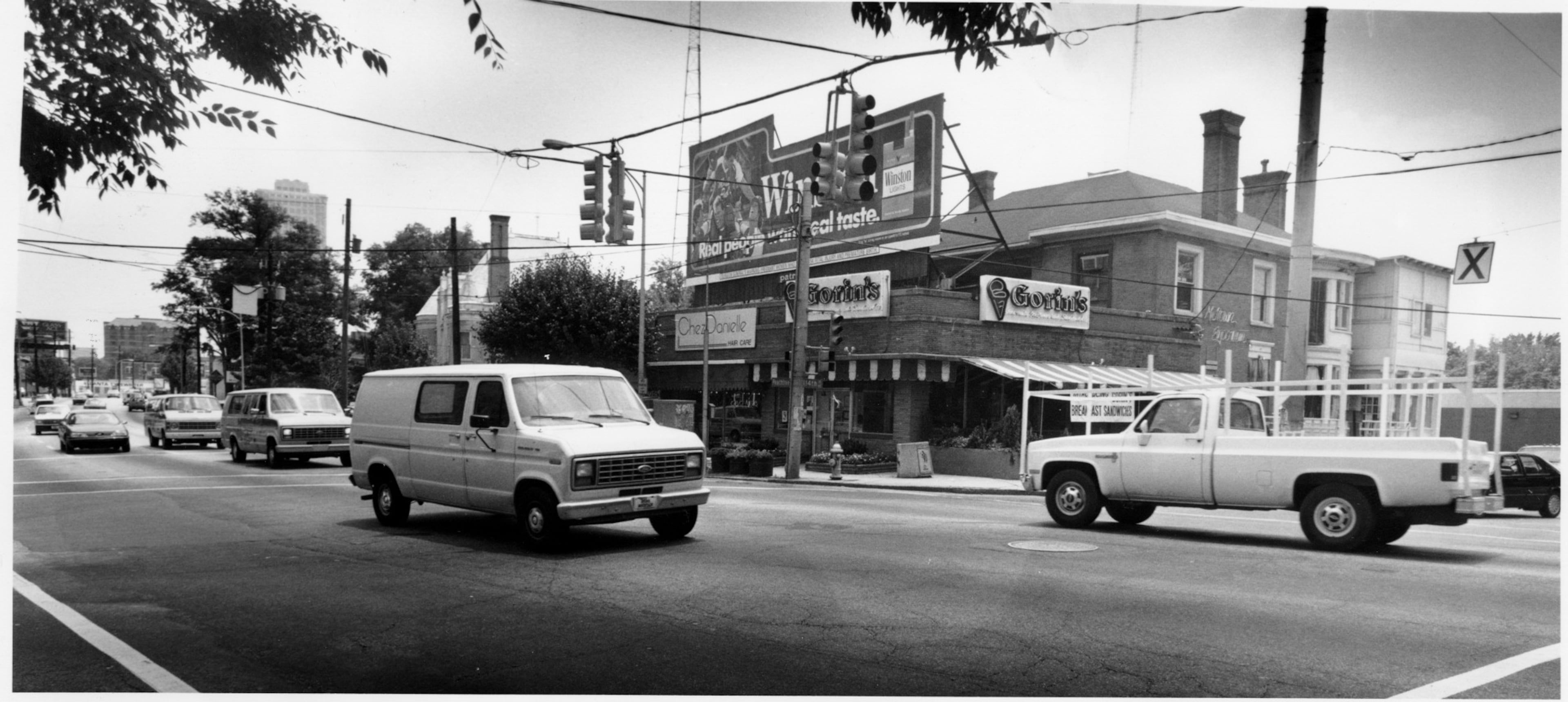 April, 1989 - Atlanta, GA -- This turn of the century house, built by Charles L. Gateley at Peachtree and 14th streets, is virtually hidden from view on Peachtree by businesses erected in front of it. (JoEllen Black/AJC staff) 1989