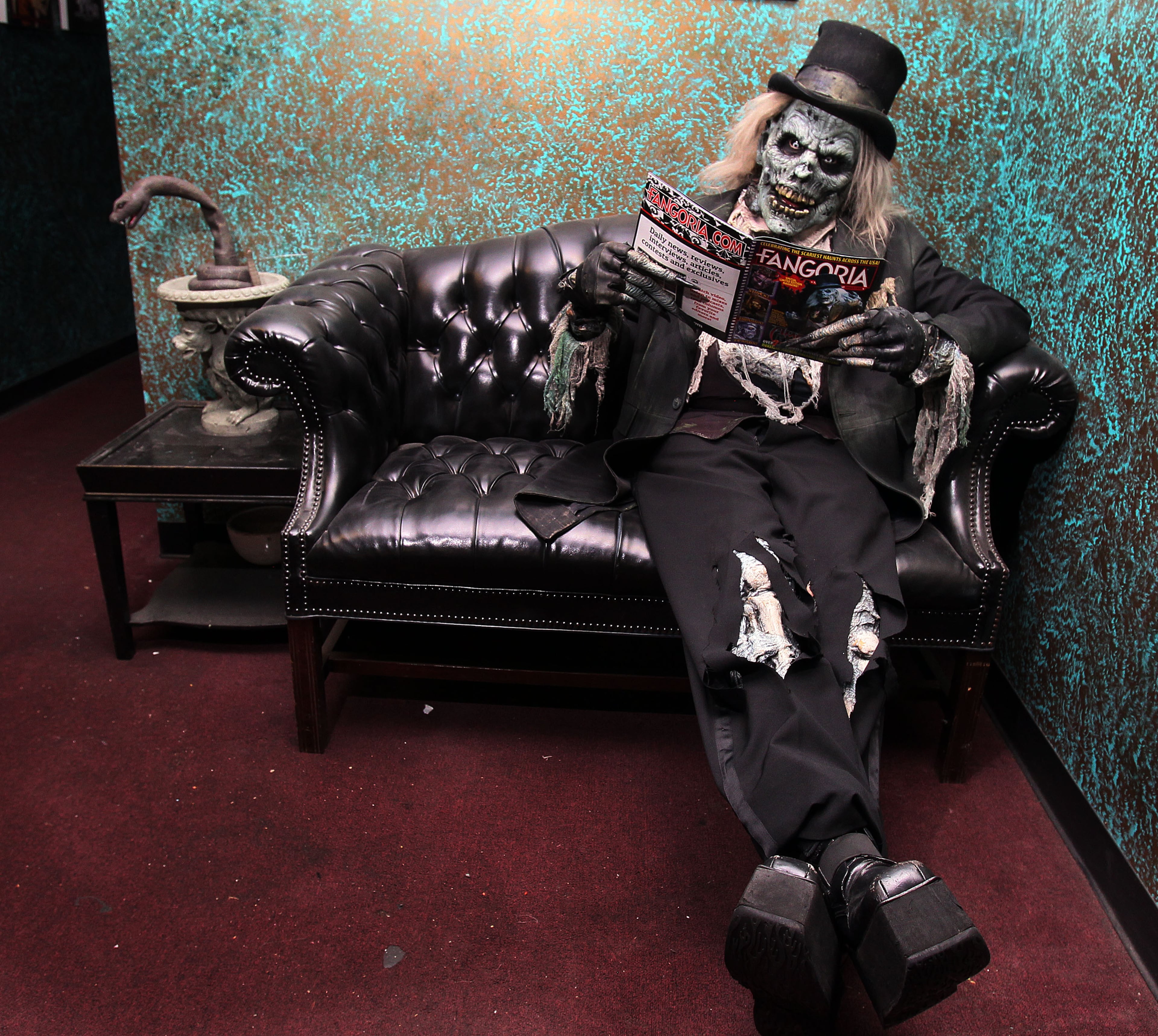 "I like to keep up with what's happening in pop culture," said The Collector while relaxing in the reading room at Netherworld Haunted House in Norcross. "Everyone wants to know me, or be me, or be dug up by me."