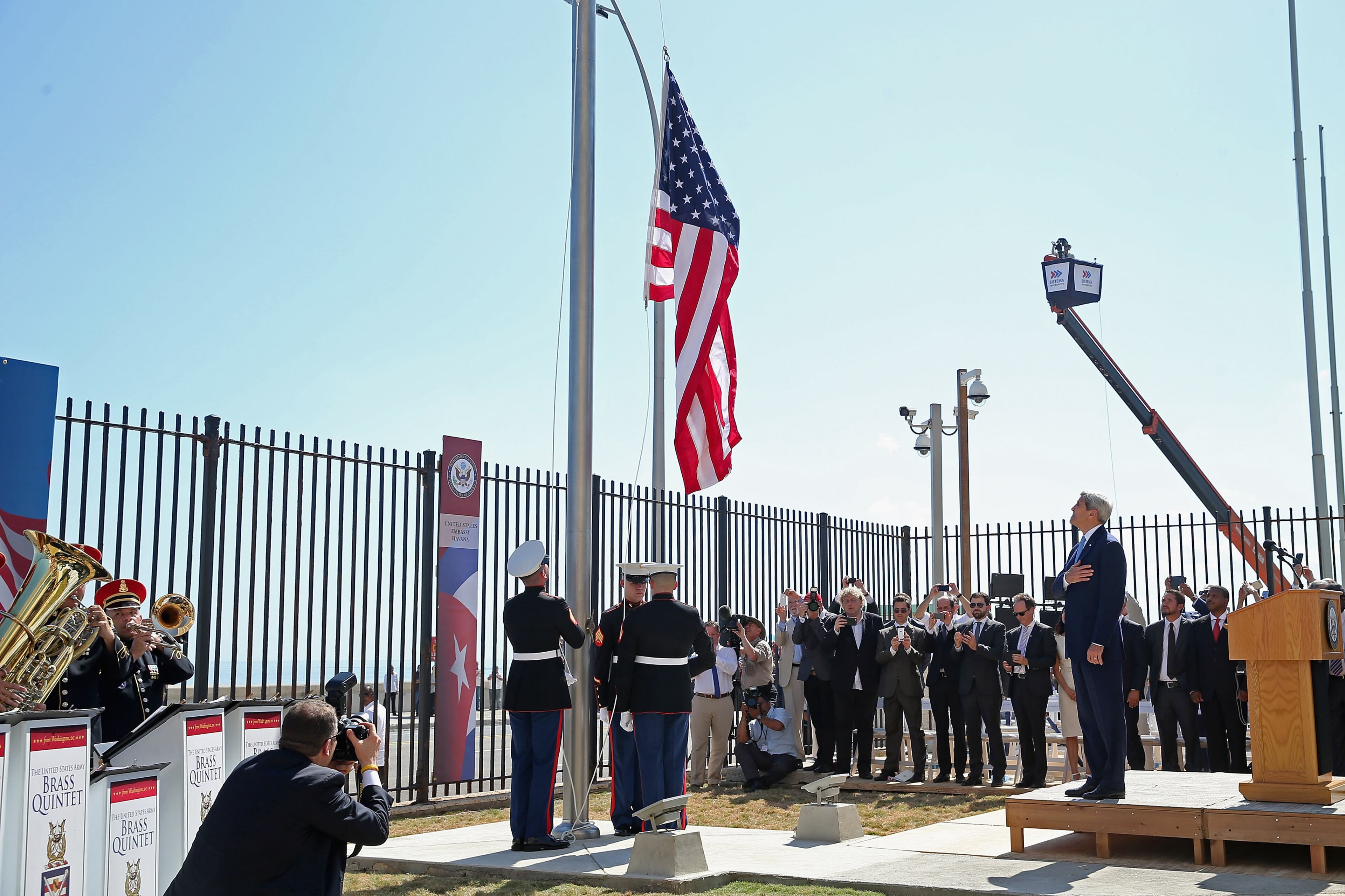 HAVANA, CUBA - AUGUST 14: Secretary of State John Kerry (R) watches as Marines raise the American flag at the U.S. Embassy August 14, 2015 in Havana, Cuba. Kerry will visited the reopened embassy, the first time an American secretary of state has visited Cuba since 1945, a symbolic act after the the two former Cold War enemies reestablished diplomatic relations in July. (Photo by Chip Somodevilla/Getty Images)
