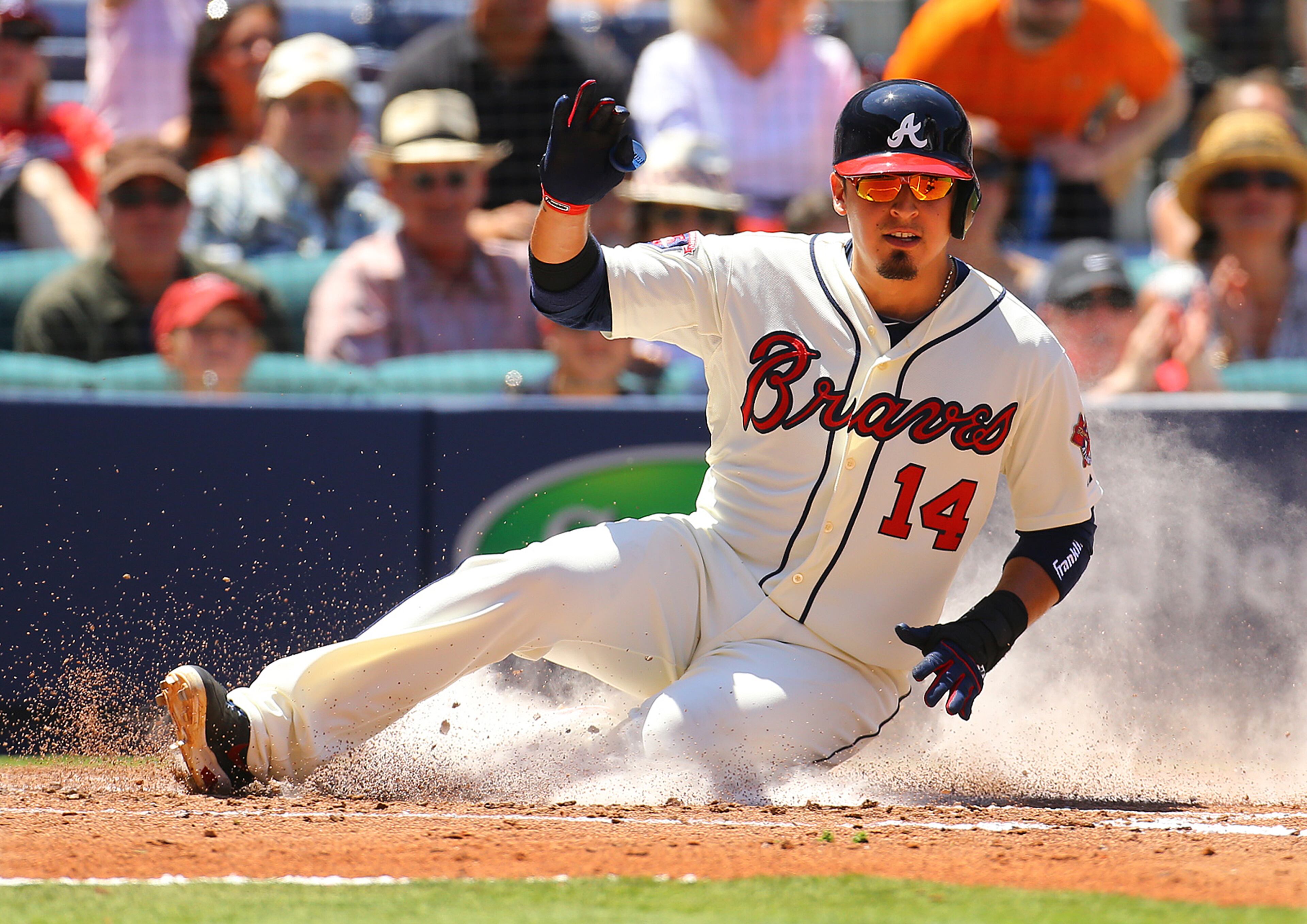 The Braves' Ramiro Pena slides home to tie the game 1-1 with the Giants on a sacrifice fly by Jason Heyward during the third inning of a MLB baseball game on Sunday, May 4, 2014, in Atlanta. CURTIS COMPTON / CCOMPTON@AJC.COM