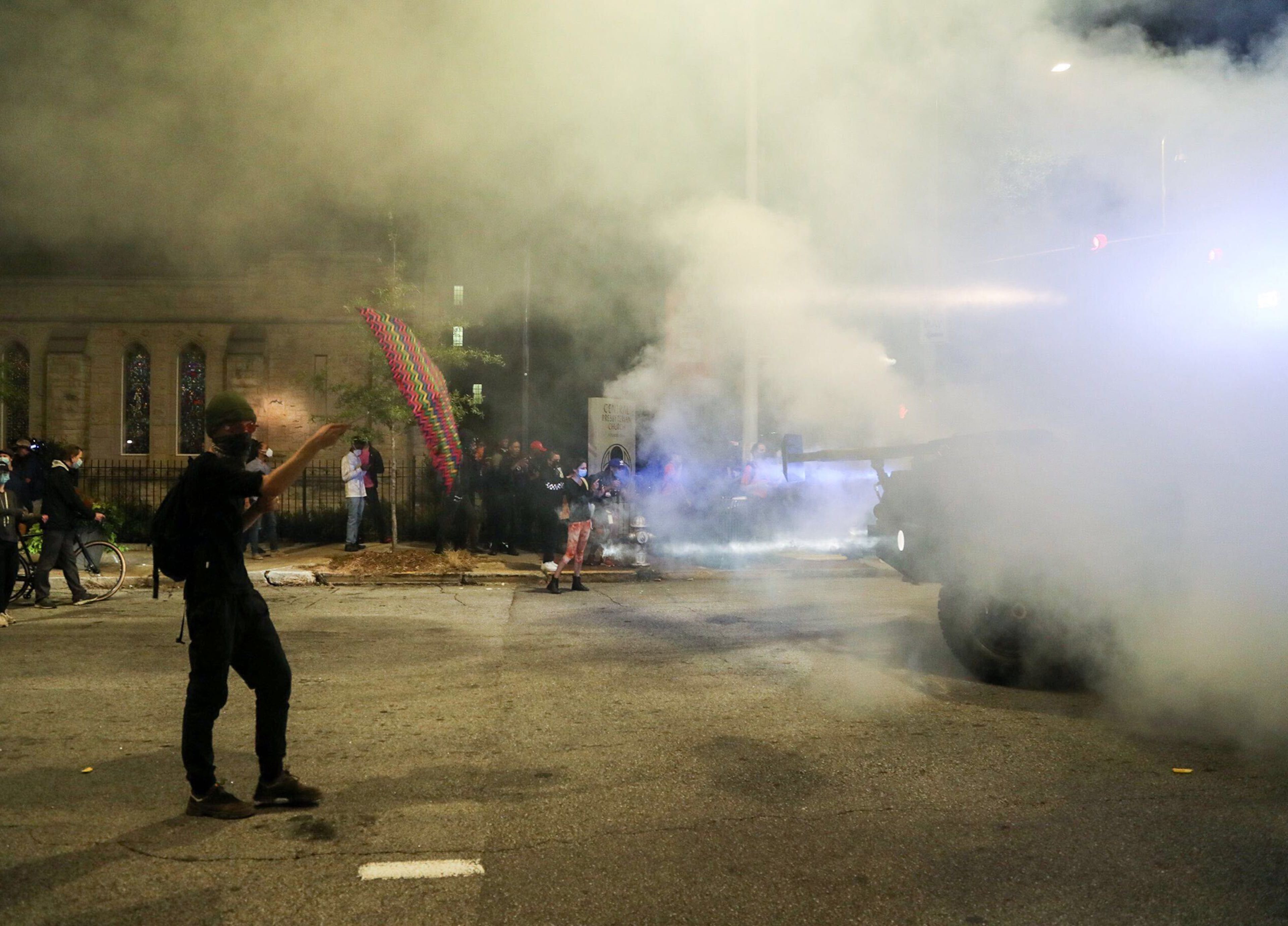 A gas is thrown toward the crowd by Georgia State Troopers on Wednesday night, Sept. 23, 2020, in an armored vehicle outside of the State Capitol Building in Atlanta. (Alyssa Pointer/Alyssa.Pointer@ajc.com)