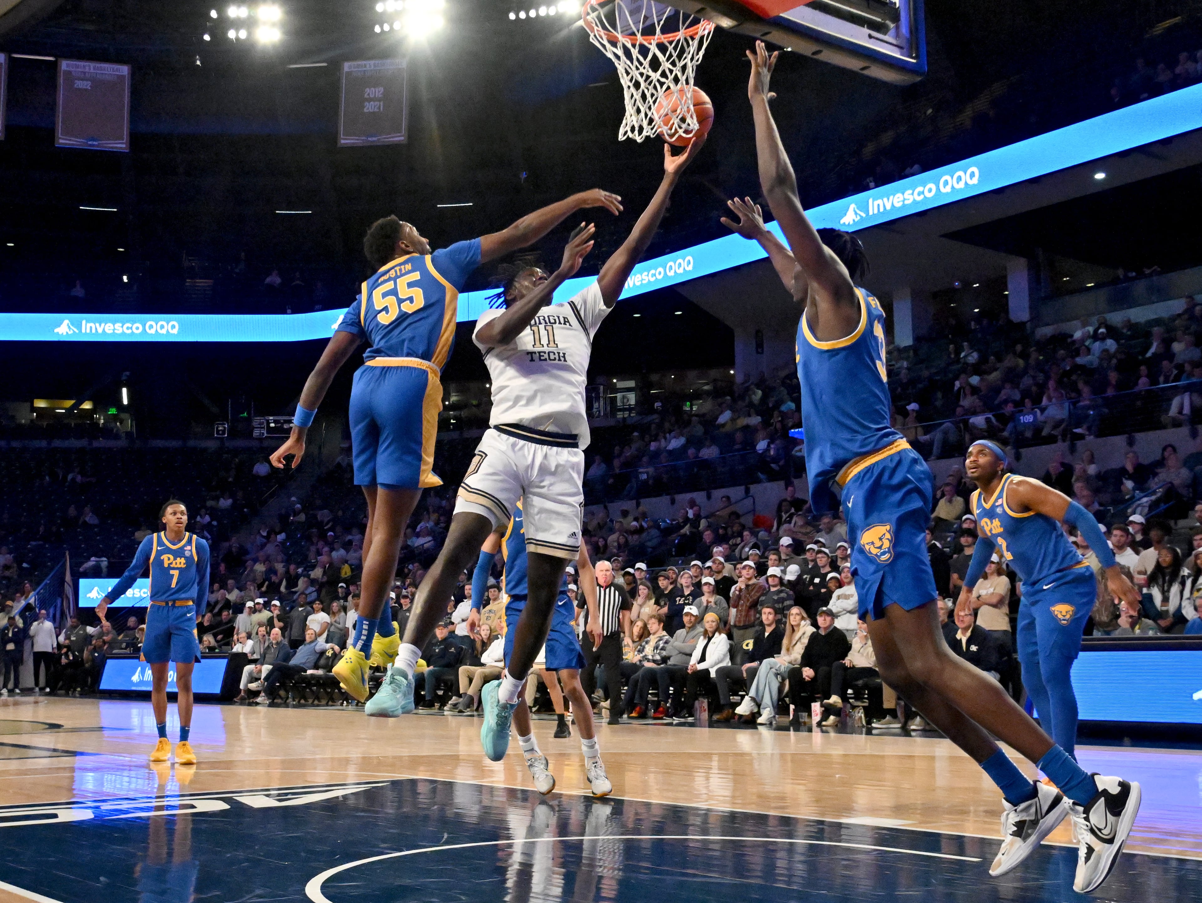 Georgia Tech forward Baye Ndongo (11) goes to the basket against Pittsburgh forward Zack Austin (55) during the first half of an NCAA college basketball game at Georgia Tech’s McCamish Pavilion, Tuesday, January 23, 2024, in Atlanta. (Hyosub Shin / Hyosub.Shin@ajc.com)