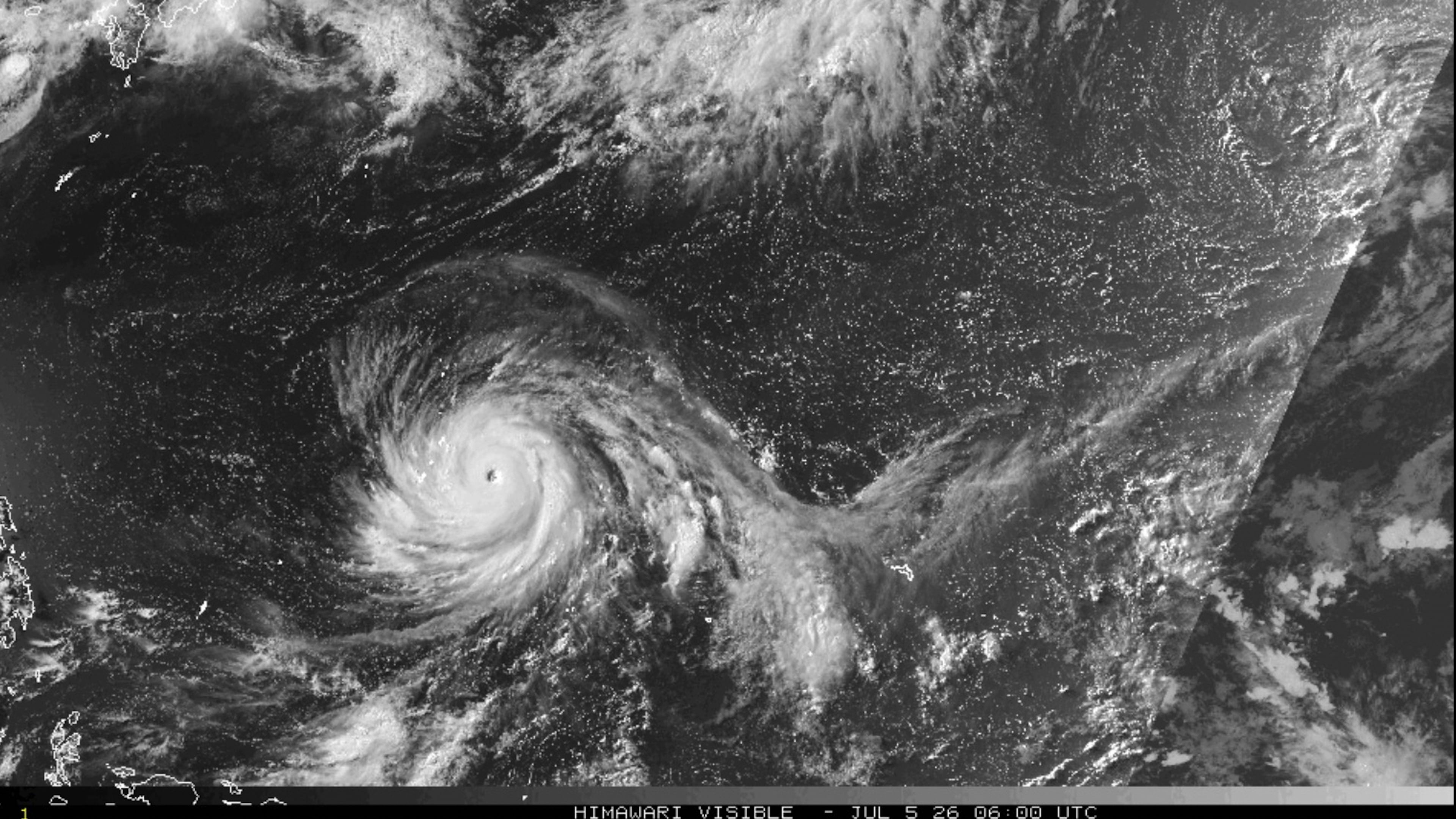 This satellite image from the National Oceanic and Atmospheric Administration shows Typhoon Bavi nearing the U.S. Pacific island territory of Guam on Sunday, July 5, 2026. (NOAA via AP)