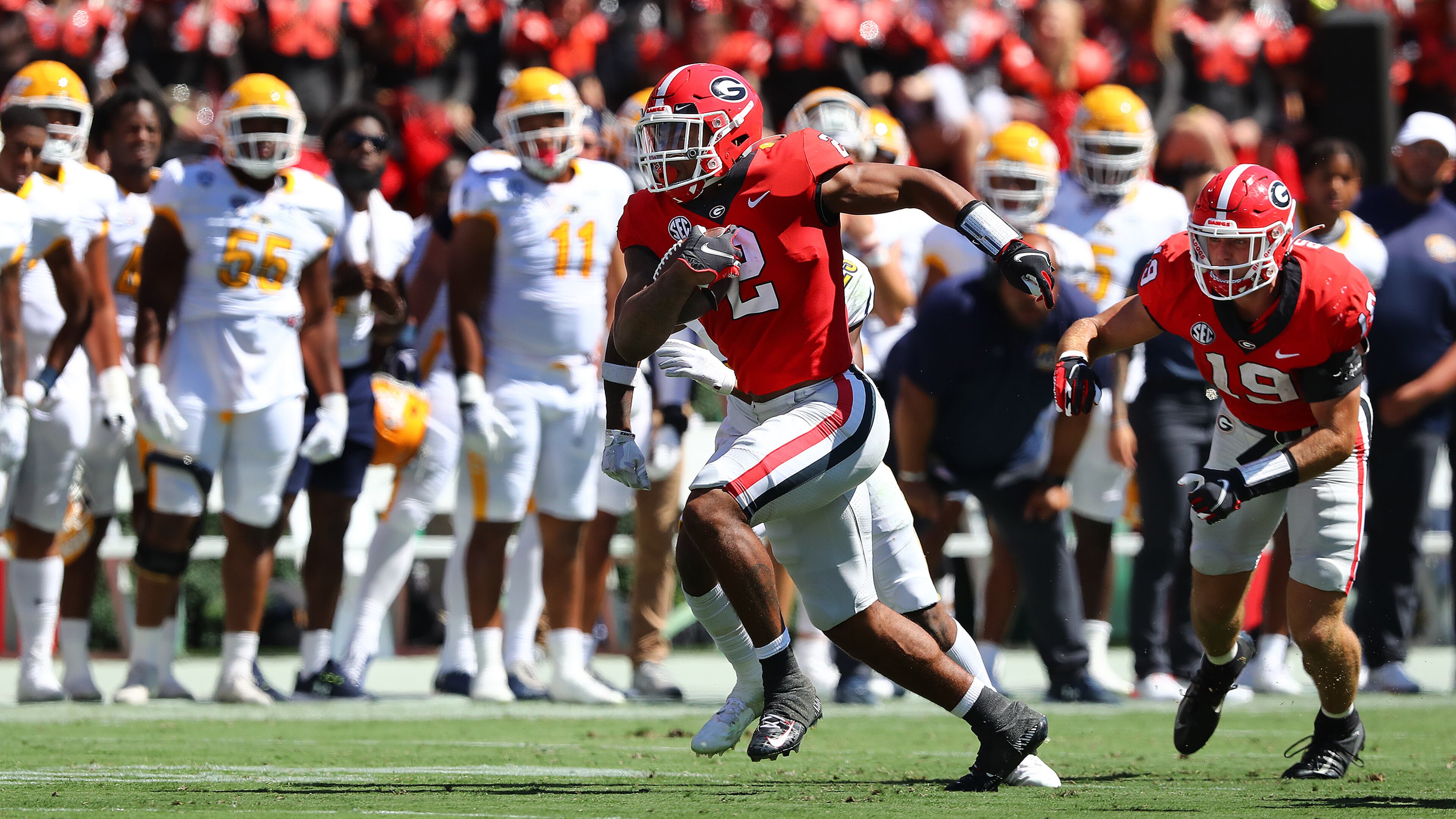 Georgia running back Kendall Milton breaks free for a long gain with tight end Brock Bowers blocking on the play against Kent State. With the number of weapons the Bulldogs have on the field, it comes as no surprise that the offense is explosive in most of Georgia’s drives. Yet, once the team crosses the 20-yard line, the offense’s fluidity comes to a screeching halt. (Curtis Compton / Curtis Compton@ajc.com)