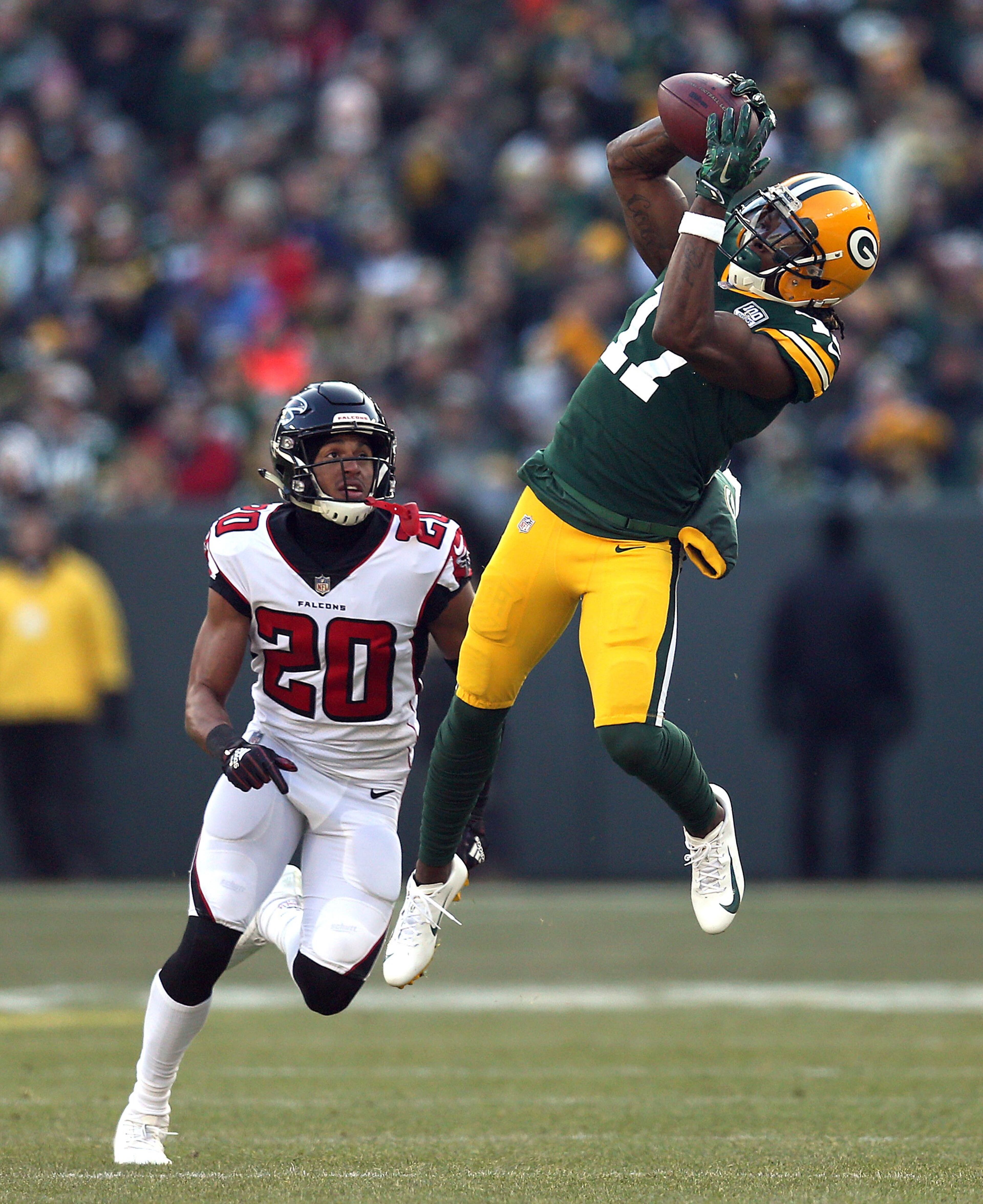 GREEN BAY, WISCONSIN - DECEMBER 09: Davante Adams #17 of the Green Bay Packers catches a pass in front of Isaiah Oliver #20 of the Atlanta Falcons during the first half of a game at Lambeau Field on December 09, 2018 in Green Bay, Wisconsin. (Photo by Dylan Buell/Getty Images)