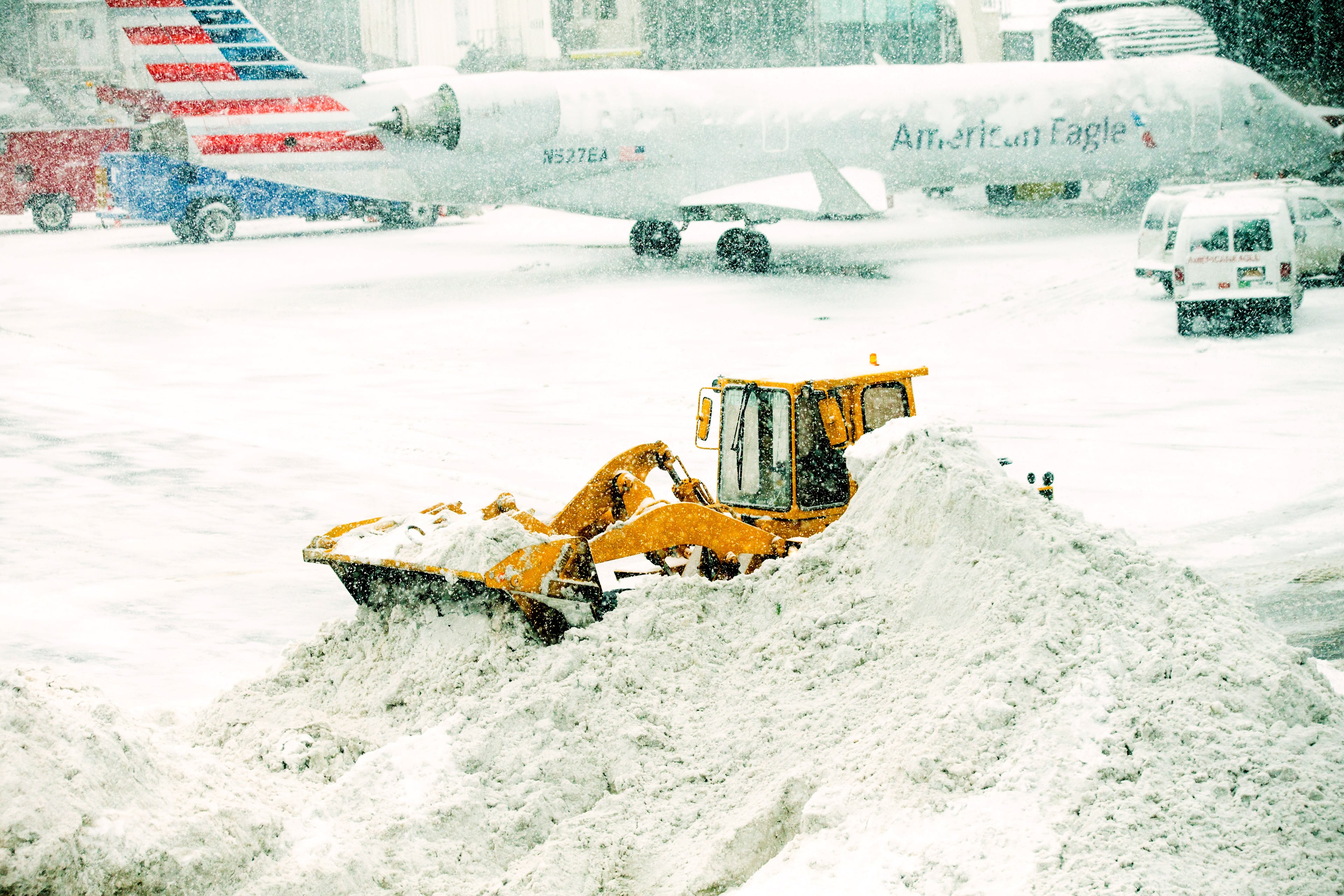 NEW YORK, NY - MARCH 5: A front loader plows snow March 5, 2015 at LaGuardia Airport in the Queens borough of New York City. A Delta jet partially skidded off a runway at the airport while trying to land in a snowstorm. (Photo by Andrew Theodorakis/Getty Images).