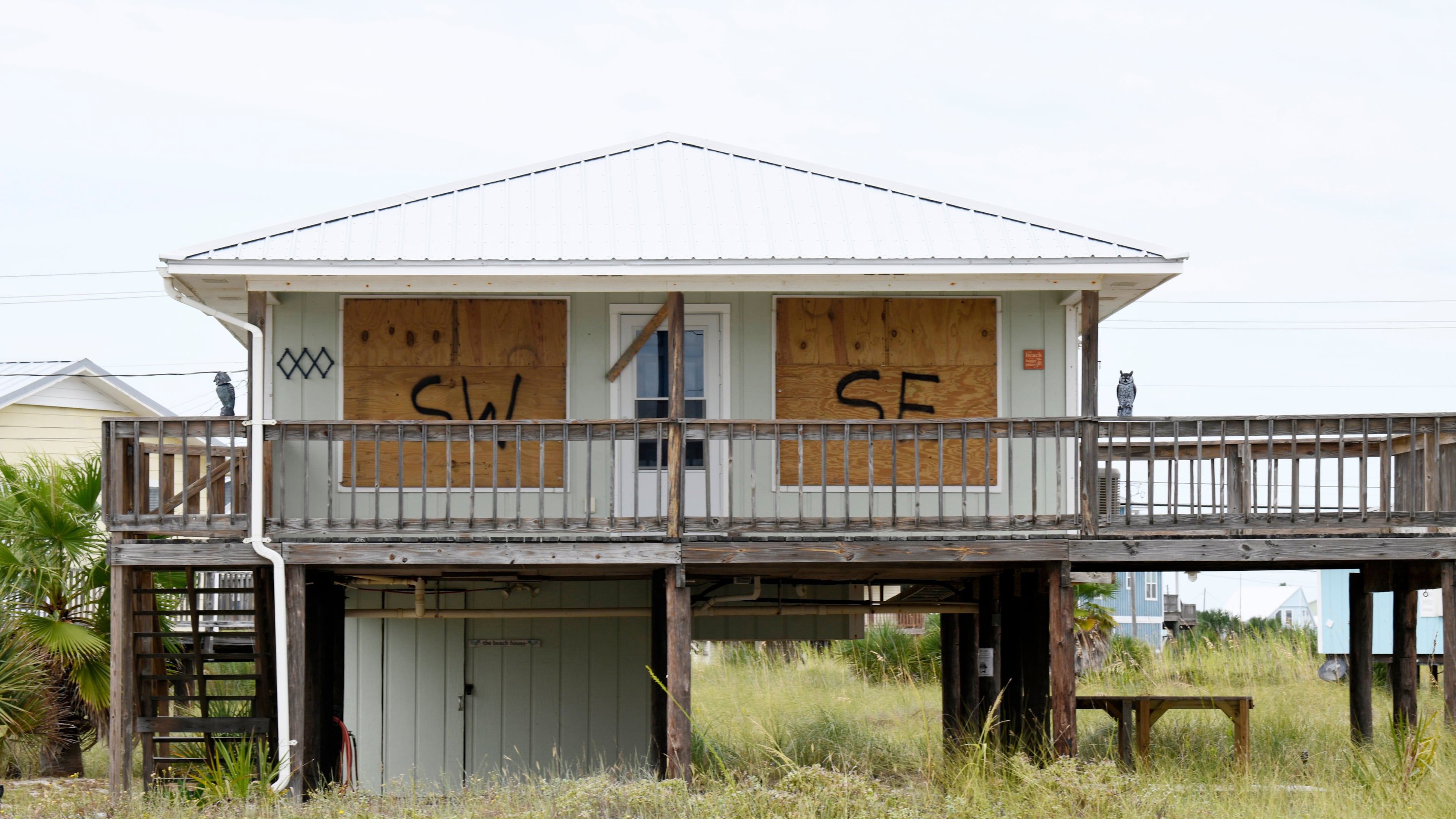 A home is boarded up with plywood ahead of Hurricane Isaias’ expected landfall along the Gulf Coast in Dauphin Island, Alabama, Thursday, Oct. 8, 2026. (AP Photo/Octavio Jones)