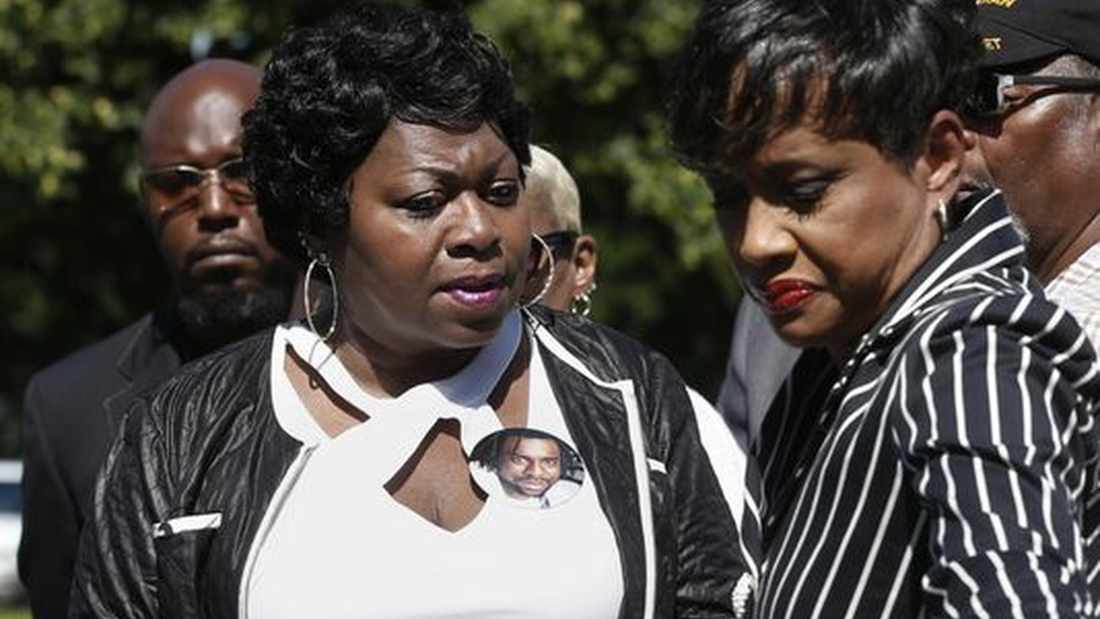 Judge Glenda Hatchett (right) escorts Valerie Castile, the mother of Philando Castile, off the platform after a news conference on the State Capitol grounds Tuesday in St. Paul, Minn. Hatchett, known for the TV show “Judge Hatchett” and her time as chief judge of the Juvenile Court of Fulton County in Atlanta, is representing the Castile family in the shooting death by police of Philando Castile last week in Falcon Heights, Minn., after a traffic stop. JIM MONE / AP