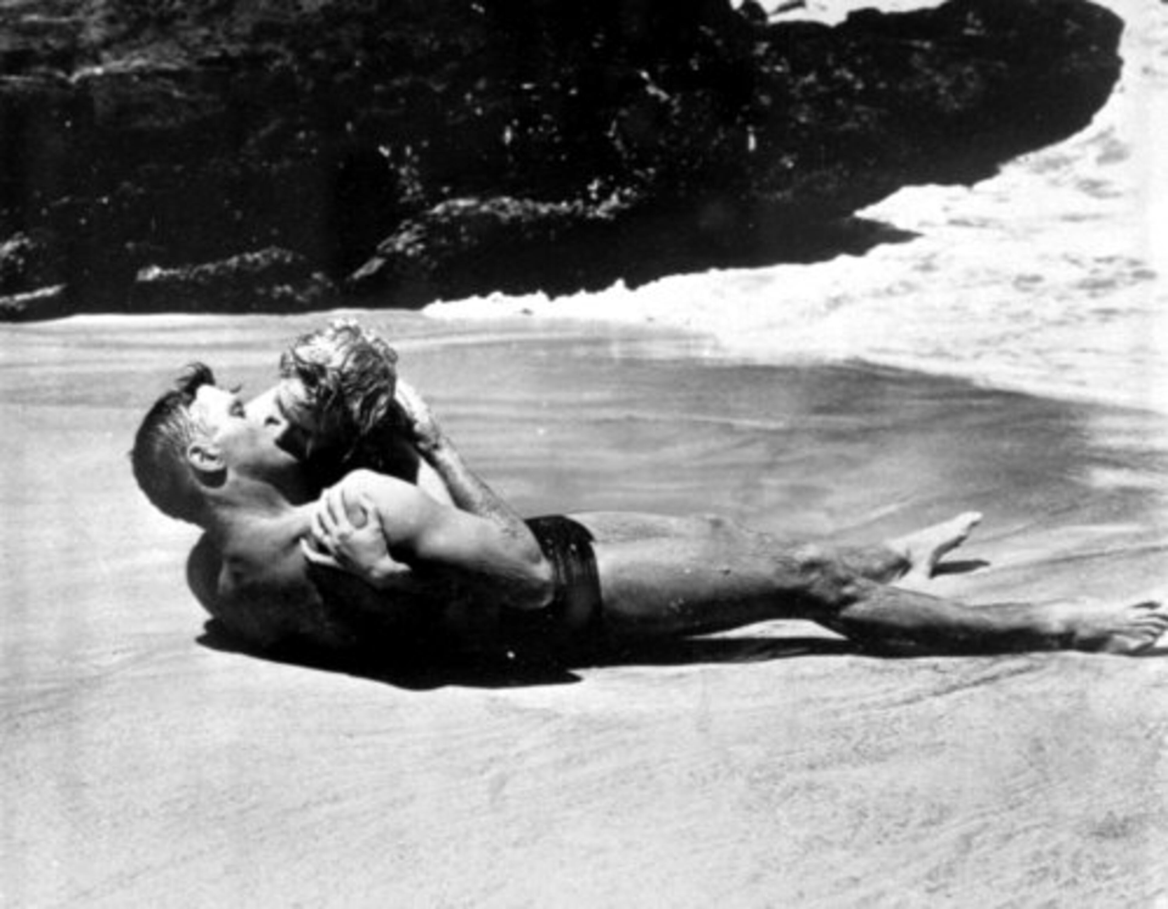 One of the more famous kissing scenes occurs in 'From Here To Eternity.' Army Sgt. Warden (Burt Lancaster) and Karen Holmes (Deborah Kerr) share an adulterous kiss on a deserted beach as the waves crash over their bodies. Afterward, Karen says, 'I never knew it could be like this. Nobody ever kissed me the way you do.' Now doesn't everyone wish his or her lover would say that?