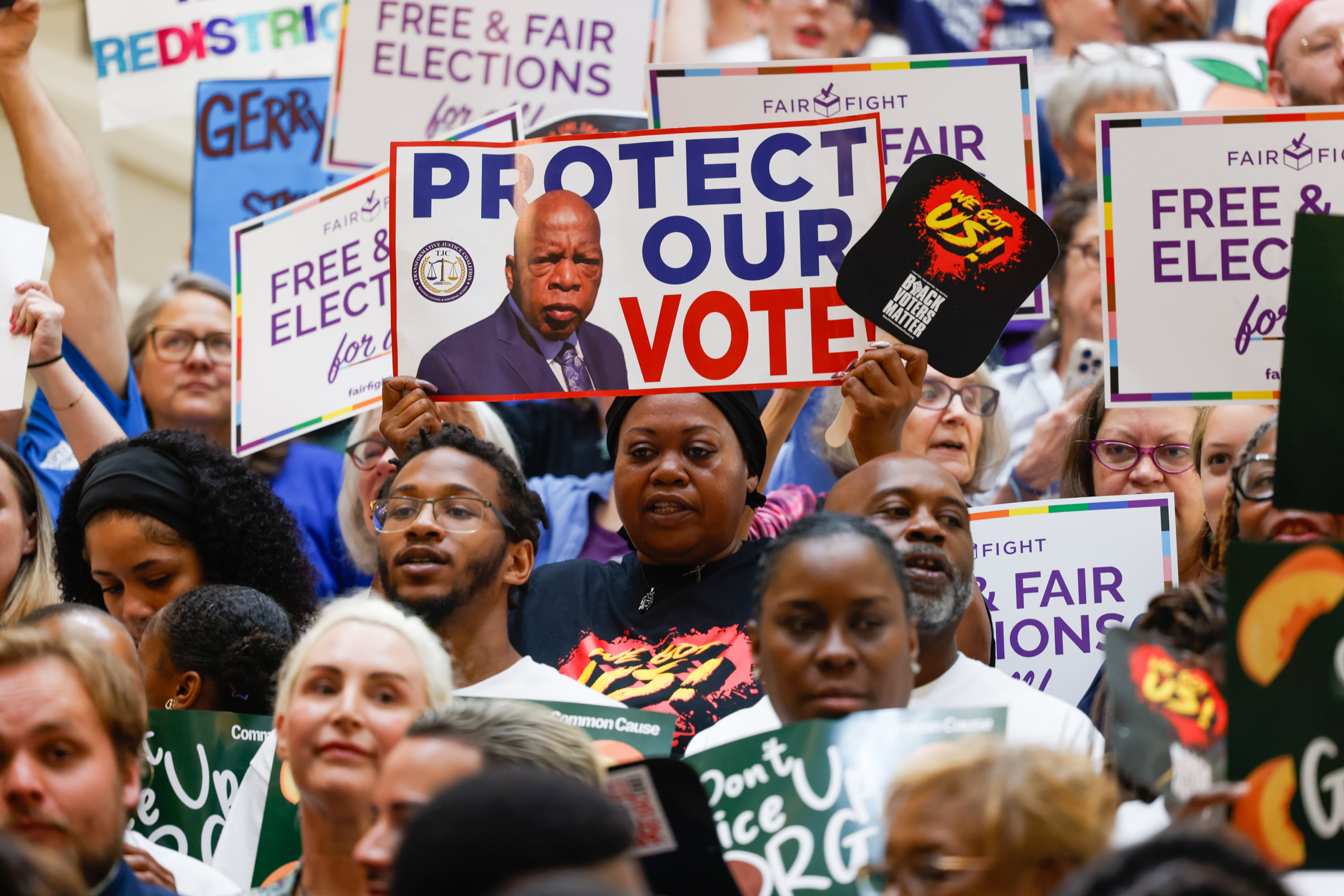Activists opposed to redistricting gather at a press conference before the state legislature convenes for a special session in Atlanta on June 17, 2026. Georgia Republican leaders later announced that they wouldn’t redraw the state’s political maps during the session. (Arvin Temkar/AJC)