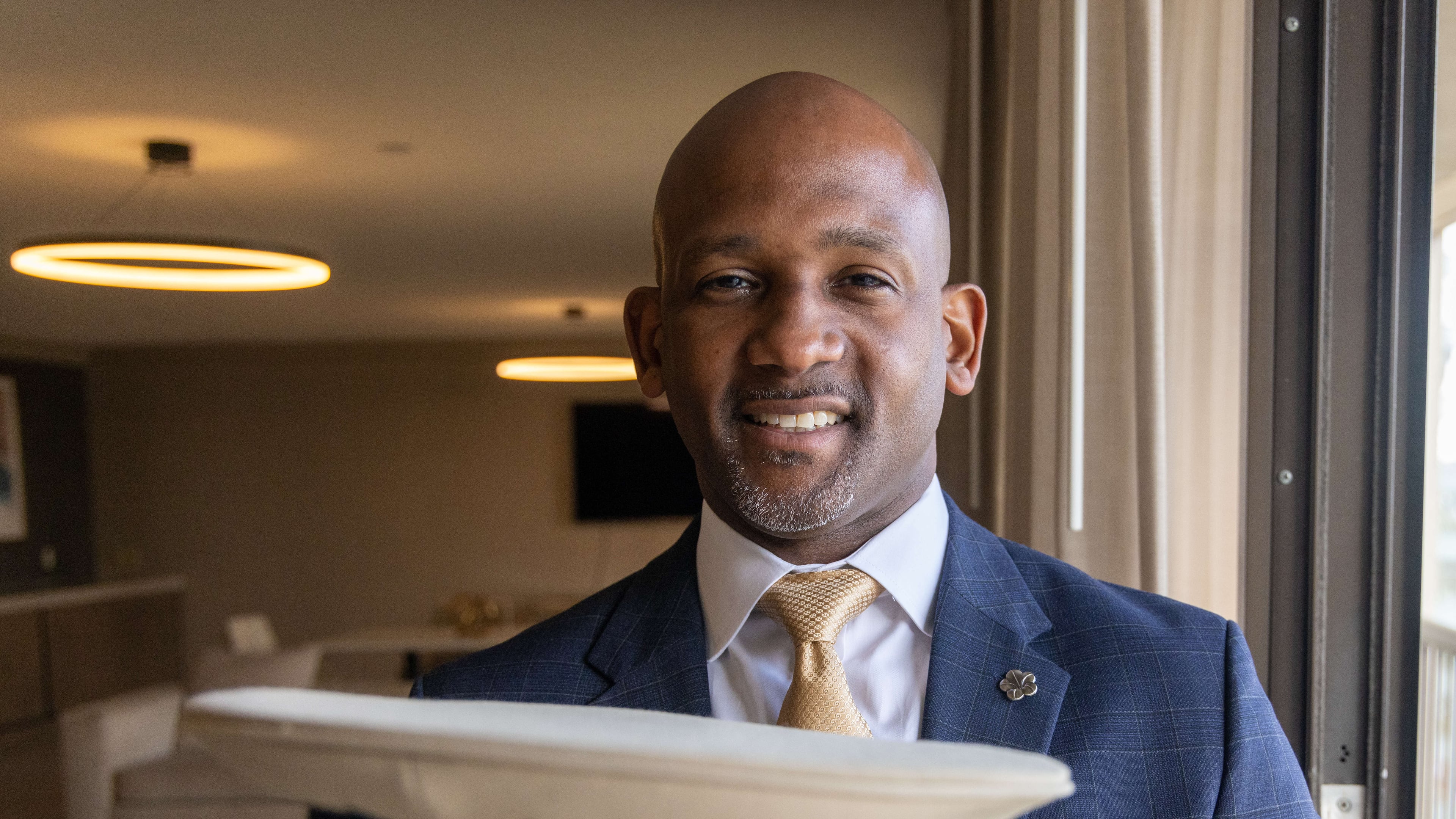 Ramon Reyes holds the doorman hat he wore when he started in the hotel industry. He is now general manager at the Omni Atlanta Hotel. PHIL SKINNER FOR THE ATLANTA JOURNAL-CONSTITUTION