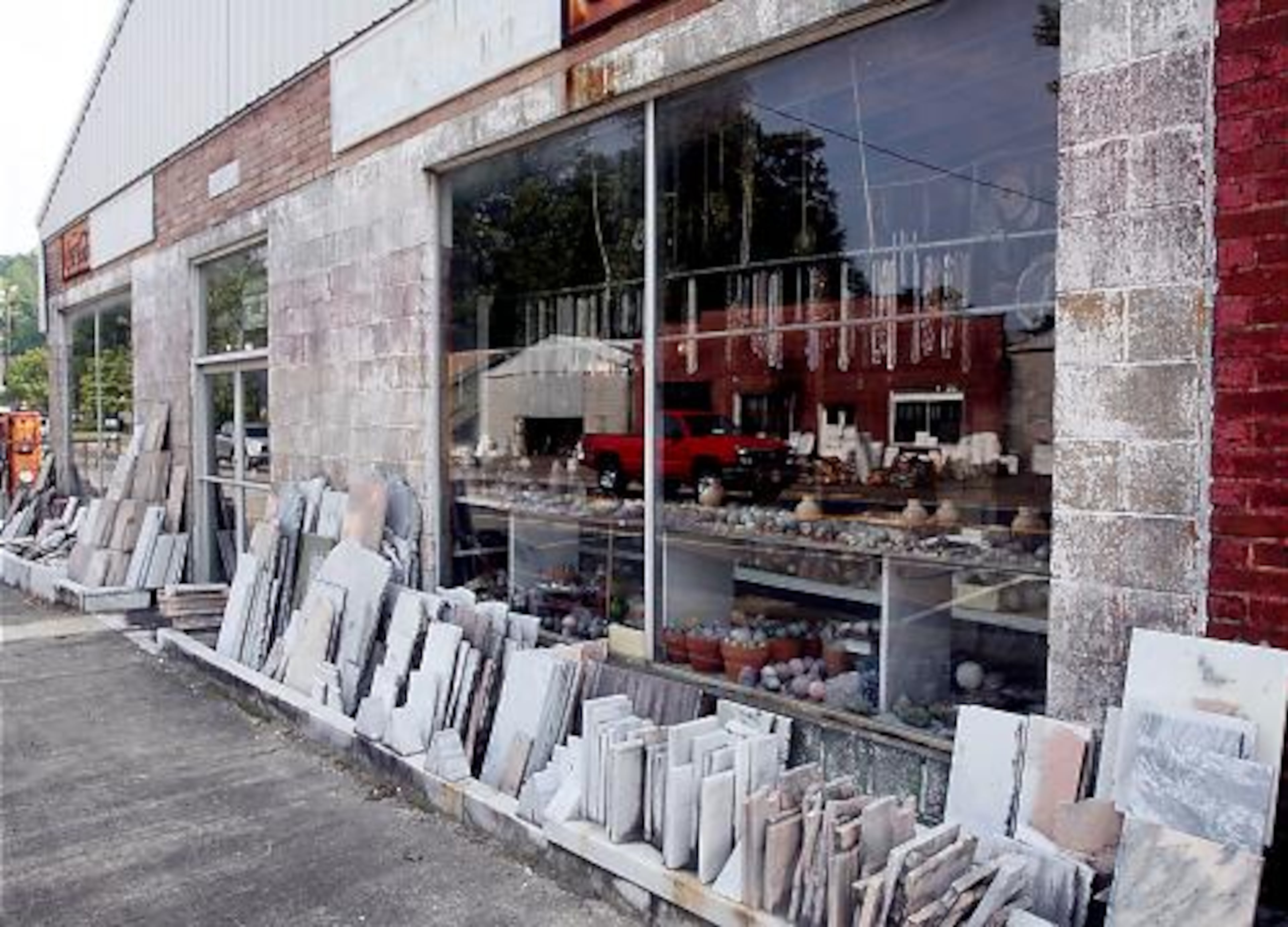 Despite a contentious relationship, Ball Ground officials knew Roberton's rocks brought tourists to their town. One City Council member had bumper stickers printed that read "Ball Ground Rocks."