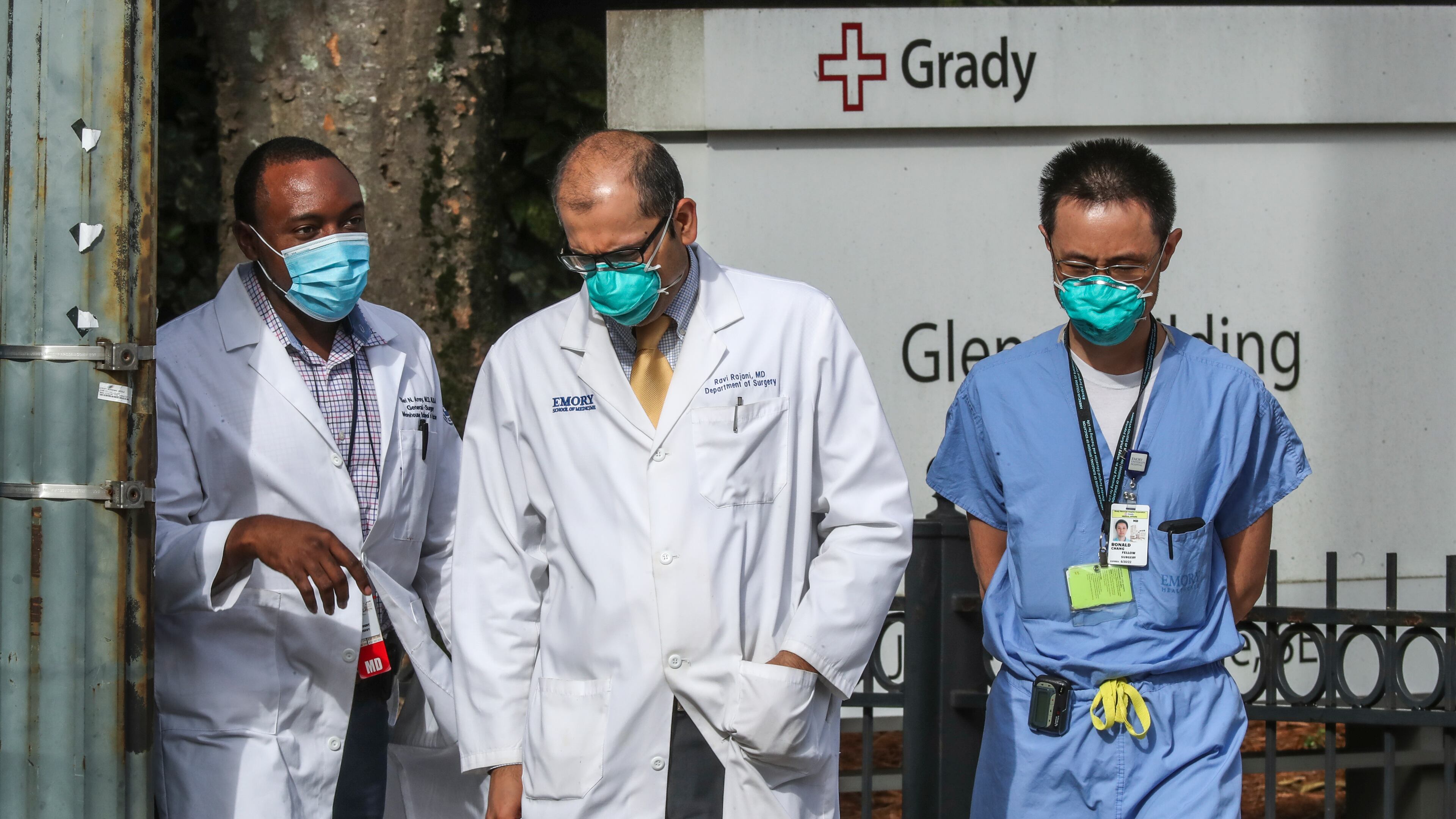 Medical workers move between buildings at Grady Memorial Hospital in downtown Atlanta on Thursday, Aug. 26, 2021 as COVID-19 cases surge in Georgia. deaths. (John Spink / John.Spink@ajc.com)