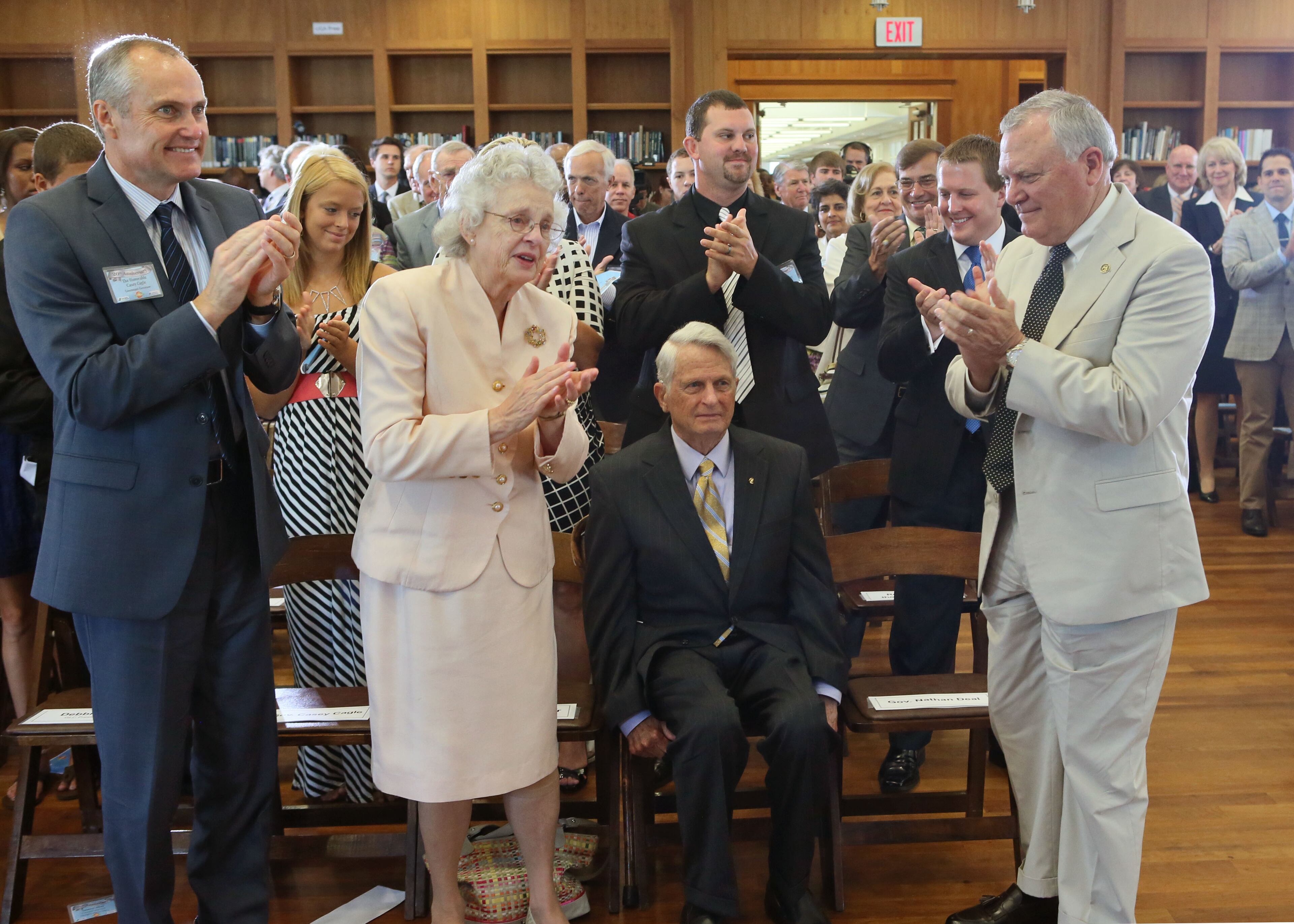 June 26, 2013 - Athens - At the close of the event, Zell Miller (seated), with his wife Shirley by his side, receives a third standing ovation. In late June 1993, Gov. Zell Miller bought the first lottery ticket ever sold in Georgia. Today, 20 years later to the day, Miller, Gov. Nathan Deal and other dignitaries gathered at the University of Georgia Zell B. Miller Learning Center for a Lottery 20th Anniversary Ceremony. BOB ANDRES / BANDRES@AJC.COM