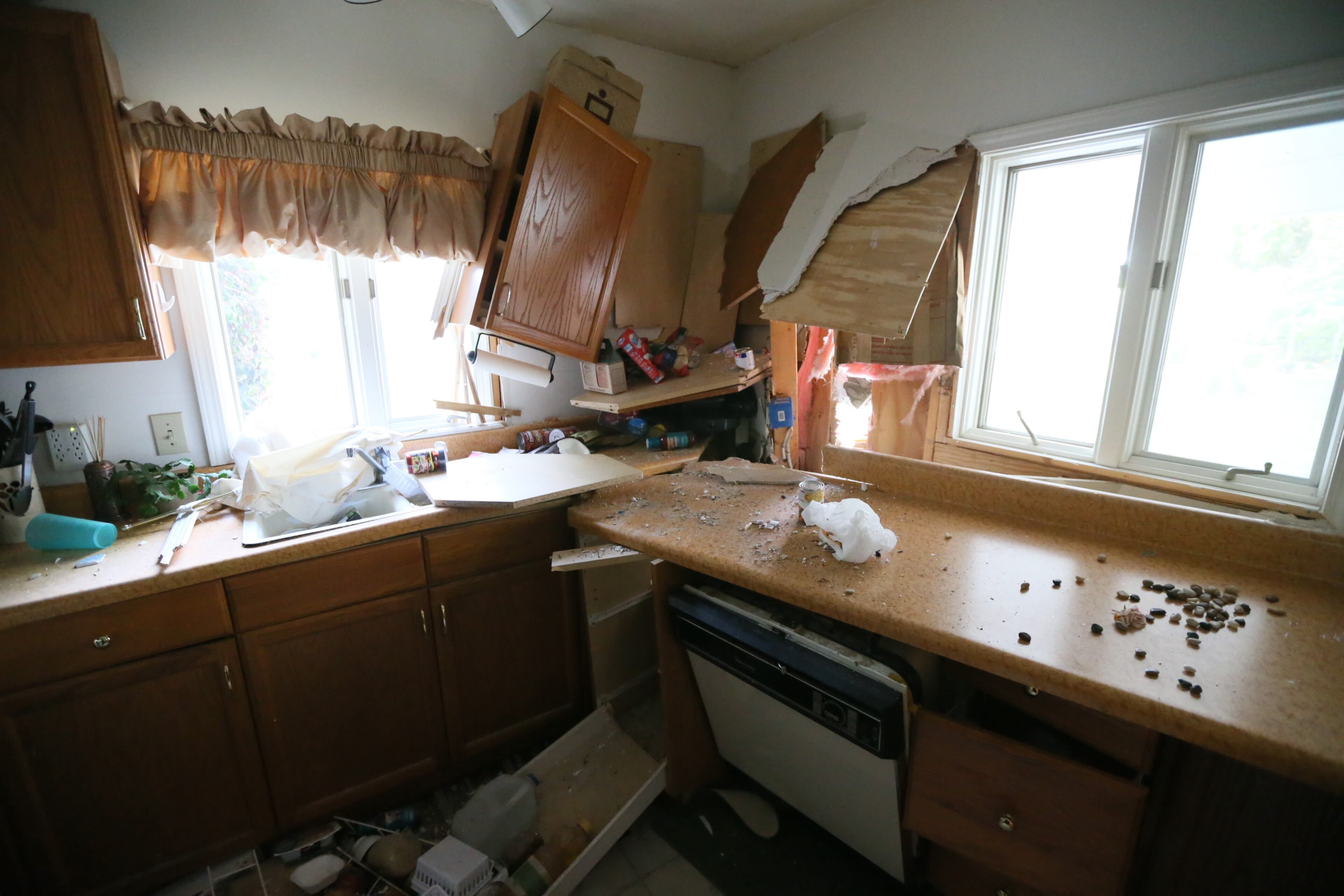 A car theft suspect fleeing police became a one-man wrecking crew early Tuesday, hitting a house as well as several cars parked along a northwest Atlanta street. JOHN SPINK@JSPINK@AJC.COM